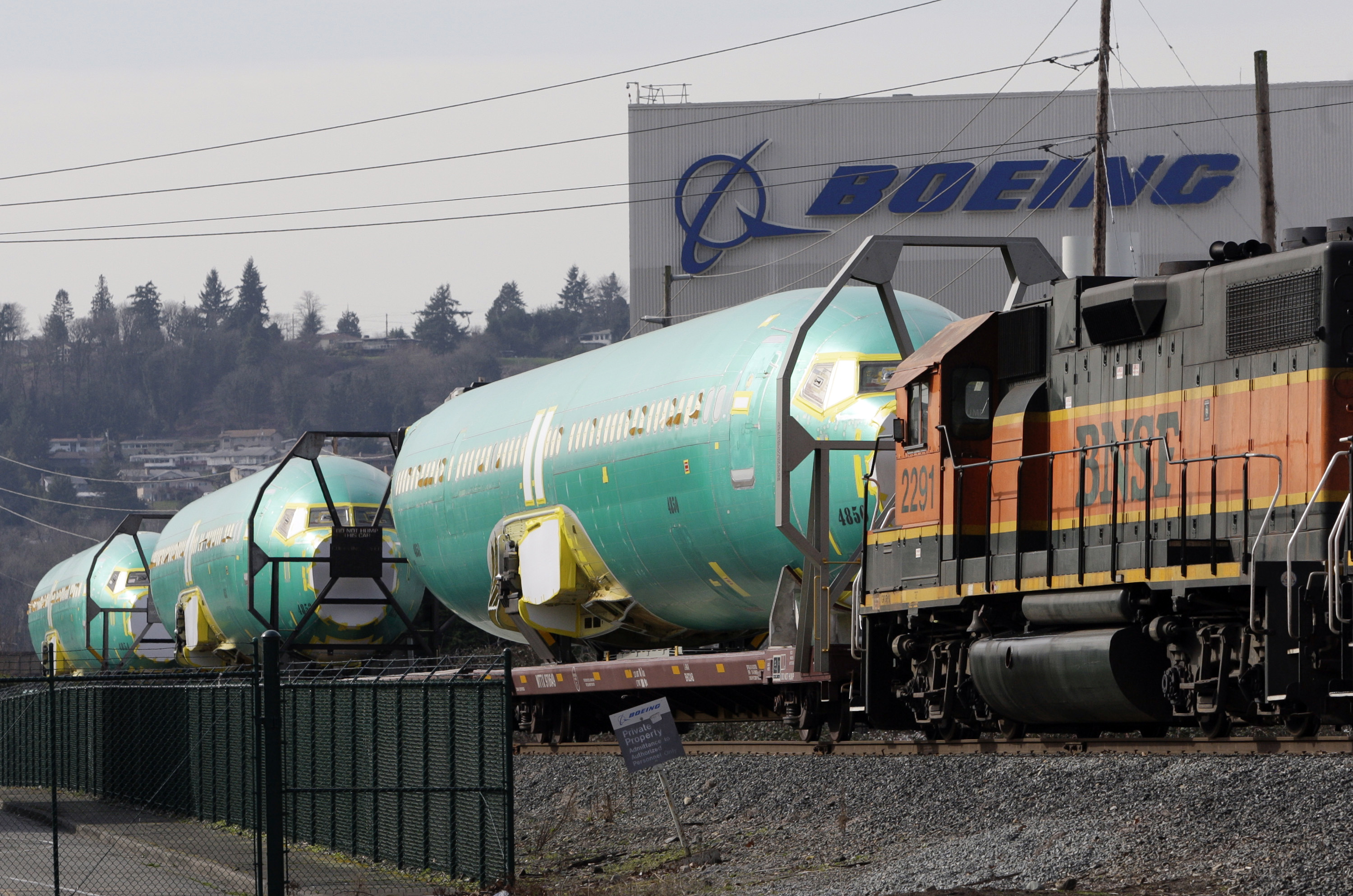 Boeing 737 fuselages are delivered by BNSF train to a Boeing manufacturing site in Renton, Washington