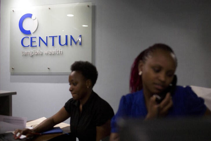 Women work at the front desk of the Centum Investment Company Limited in Nairobi, Kenya
