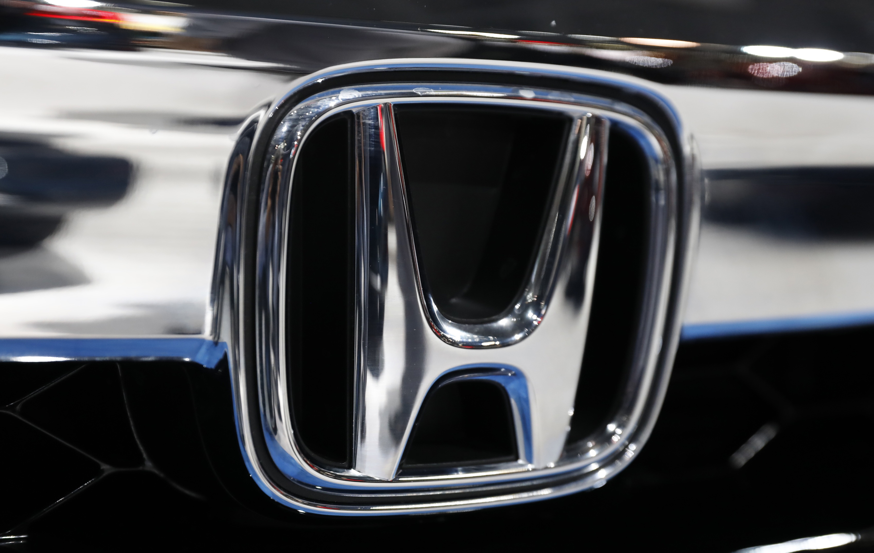 The Honda logo is seen on a Honda car at the New York Auto Show in New York