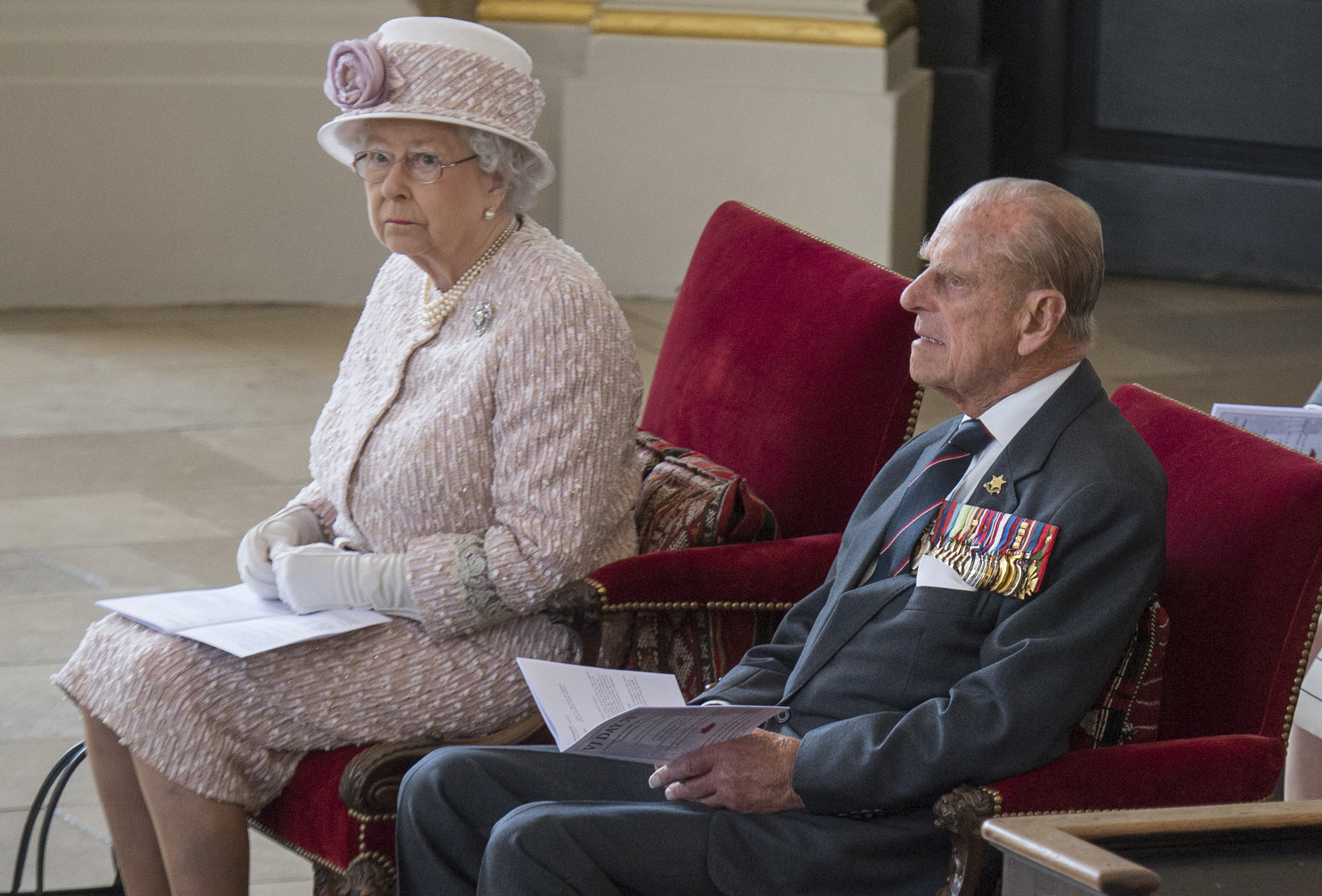 Britain's Queen Elizabeth and Prince Phillip attend a service to commemorate the 70th anniversary of VJ Day in St Martin's in the Fields church, in London, Britain August 15, 2015. REUTERS/Arthur Edwards/Pool