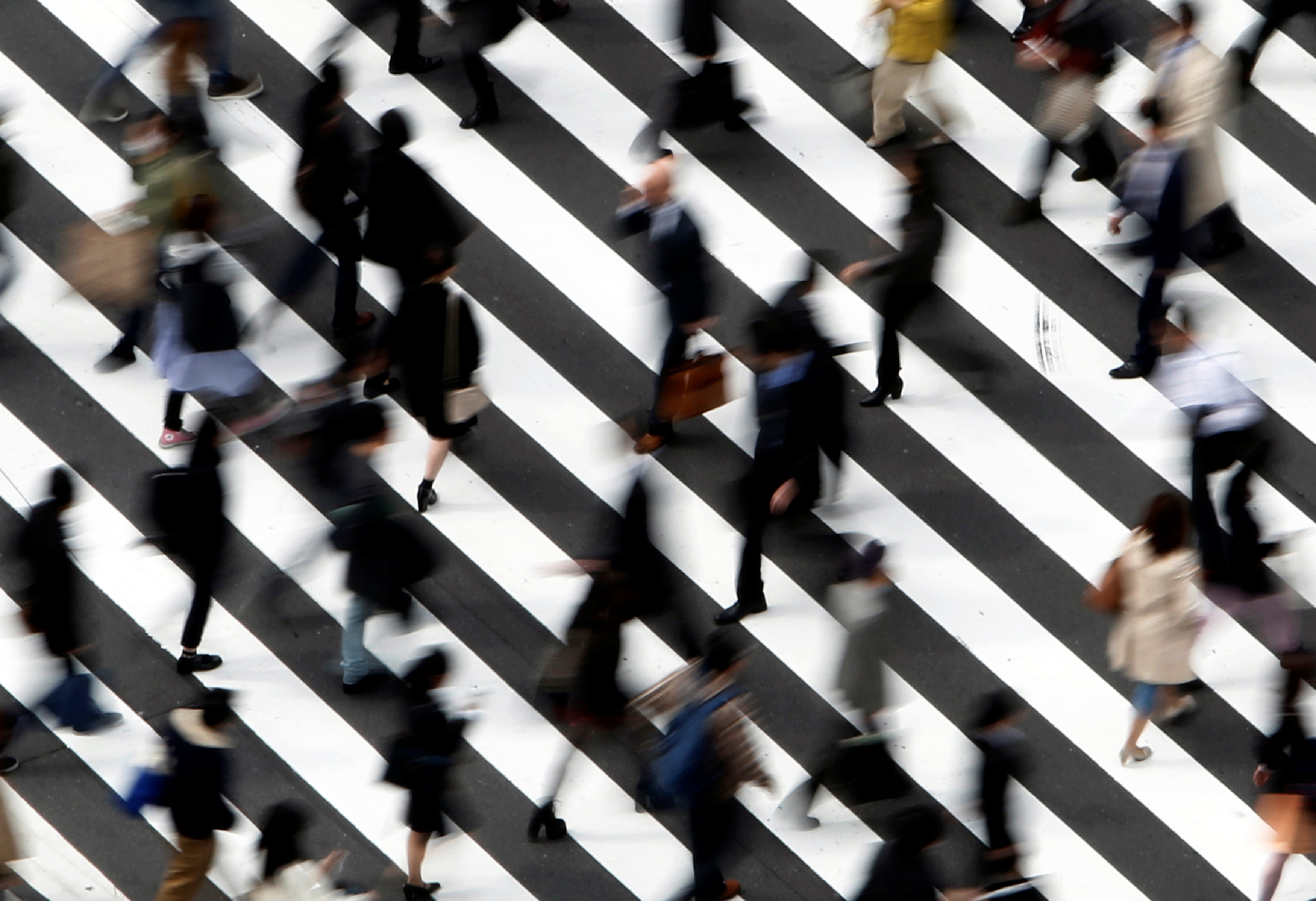 People cross a street in Tokyo