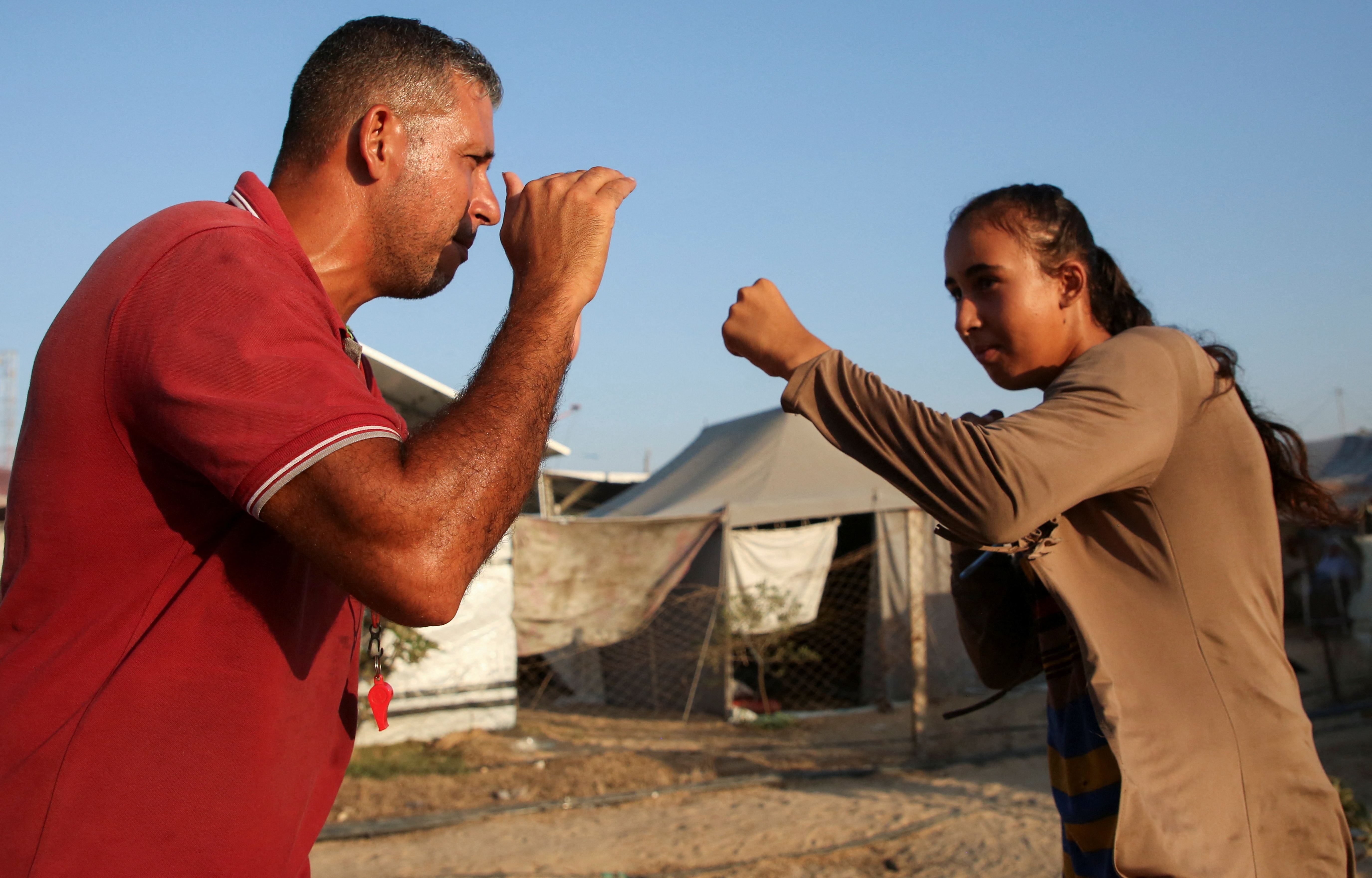 As bombs shatter Gaza, boxing coach emboldens girls