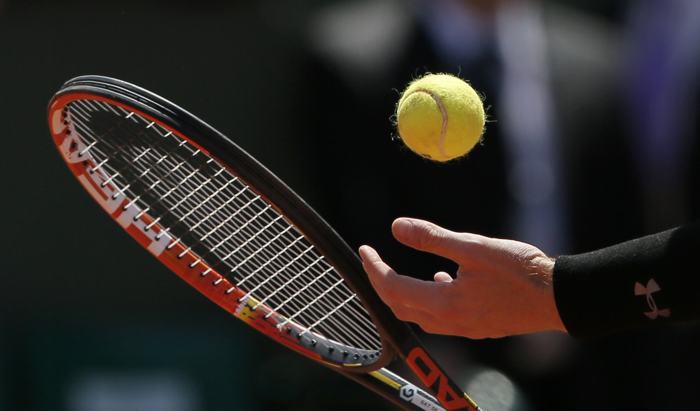 A ball and the racket of Andy Murray of Britain are pictured as he prepares to serve to Novak Djokovic of Serbia during their men's semi-final match at the French Open tennis tournament at the Roland Garros stadium in Paris
