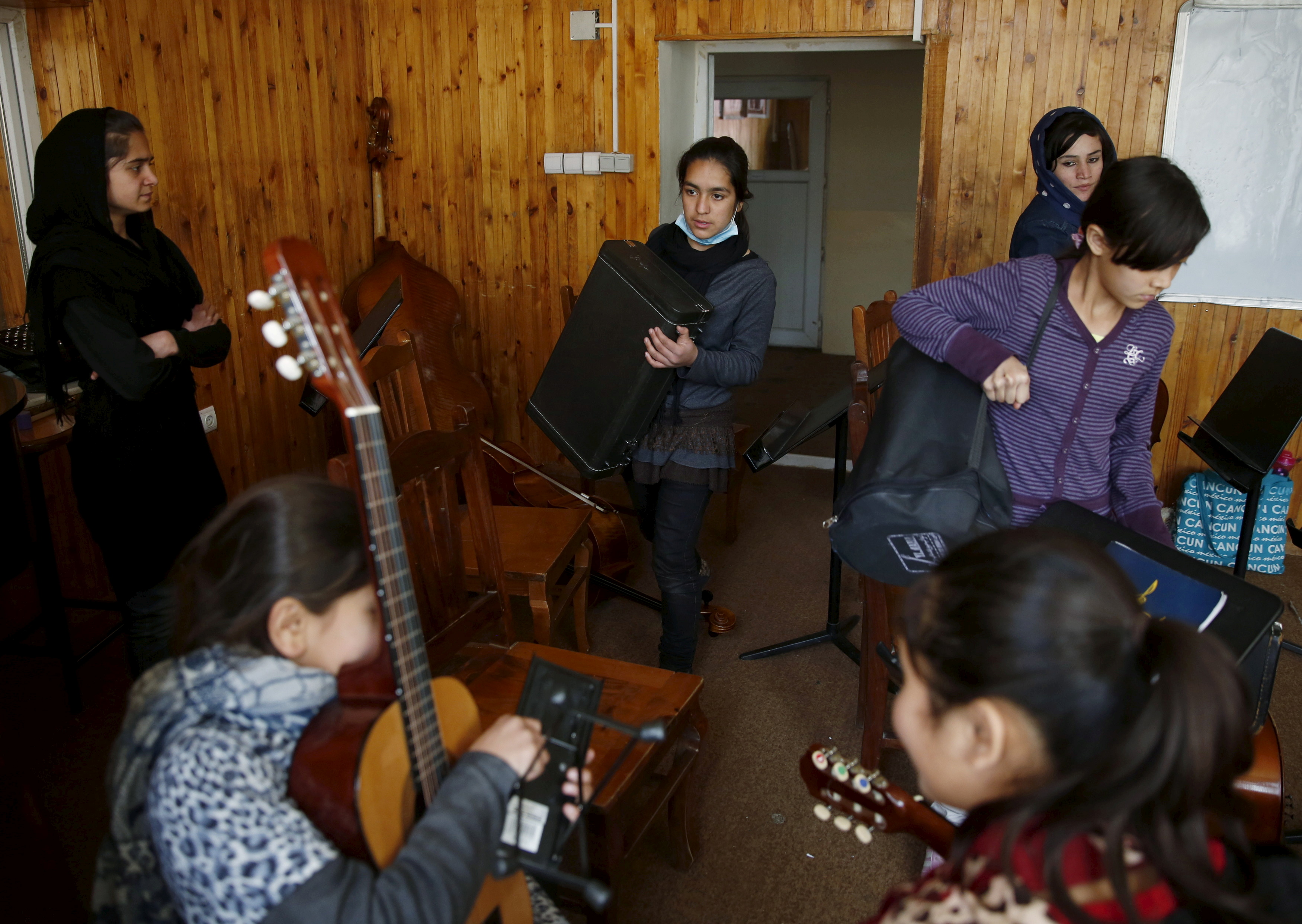 Members of the Zohra orchestra, an ensemble of 35 women, practises during a session, at Afghanistan's National Institute of Music, in Kabul