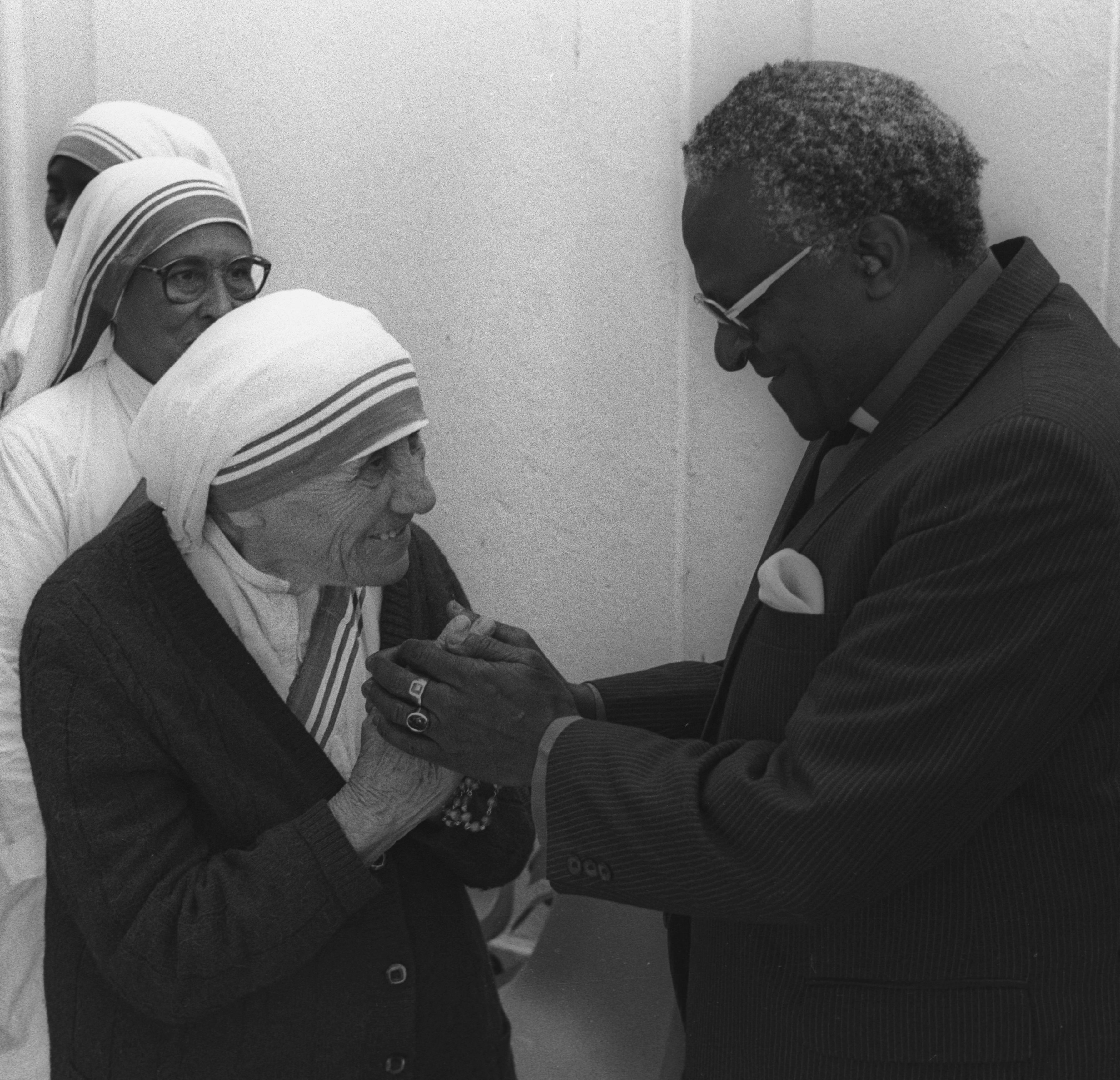 Nobel Peace Price winners Mother Teresa of Calcutta and Archbishop Desmond Tutu meet prior to a lunch in Cape Town