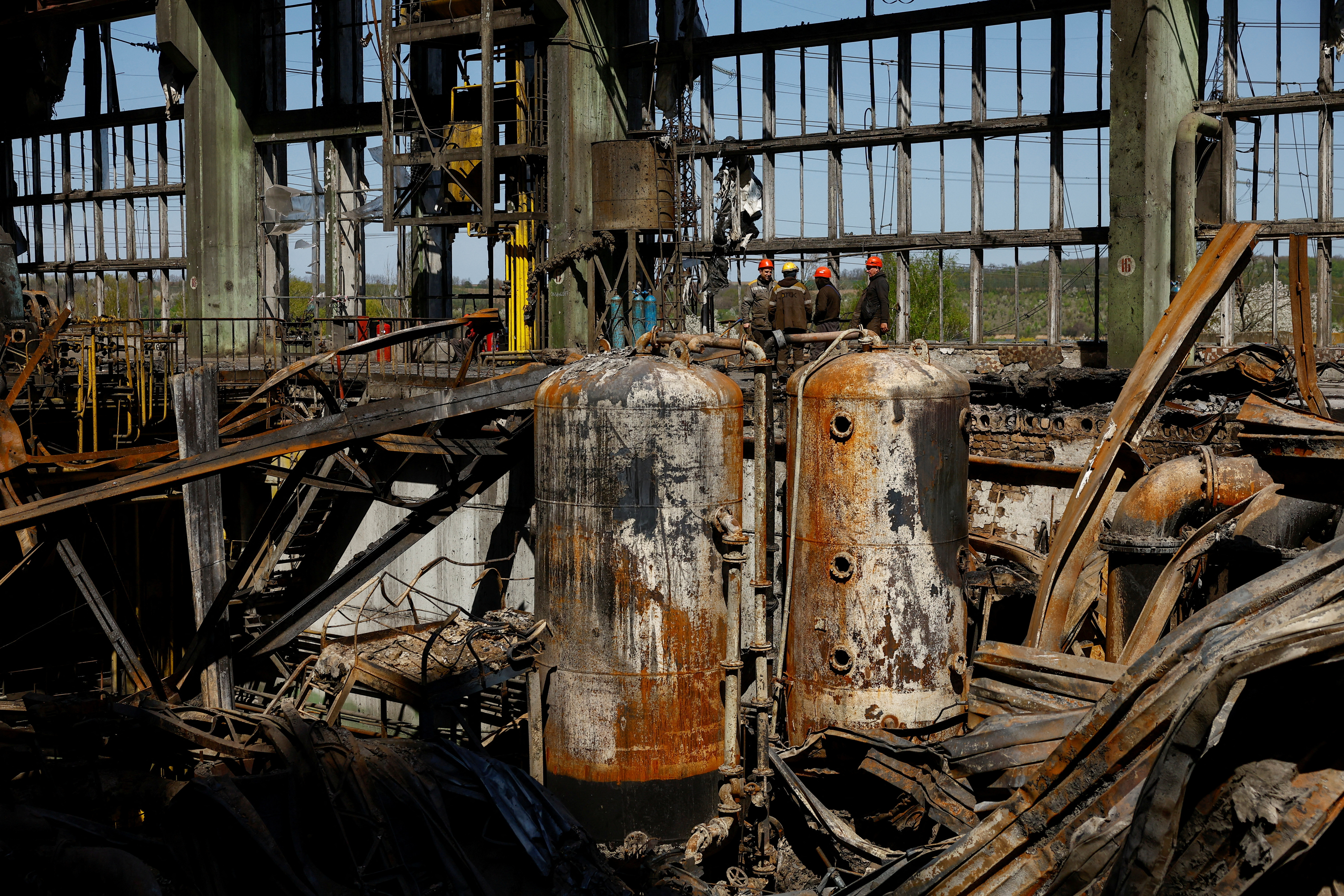 Employees work at a thermal power plant heavily damaged by recent Russian missile strikes in Ukraine