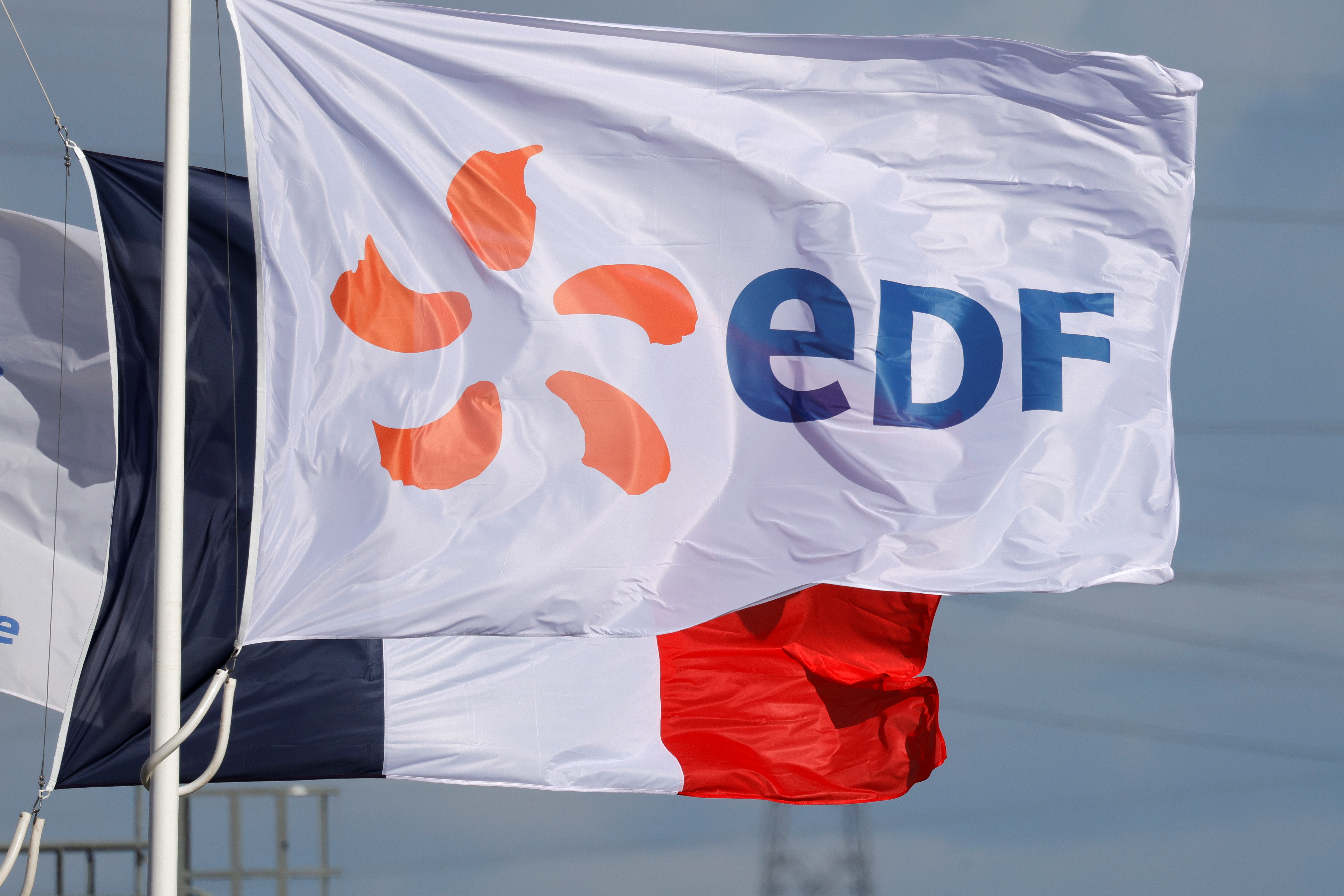 The EDF logo is seen on a flag in Bouchain, near Valenciennes, France, September 29, 2021. REUTERS/Pascal Rossignol