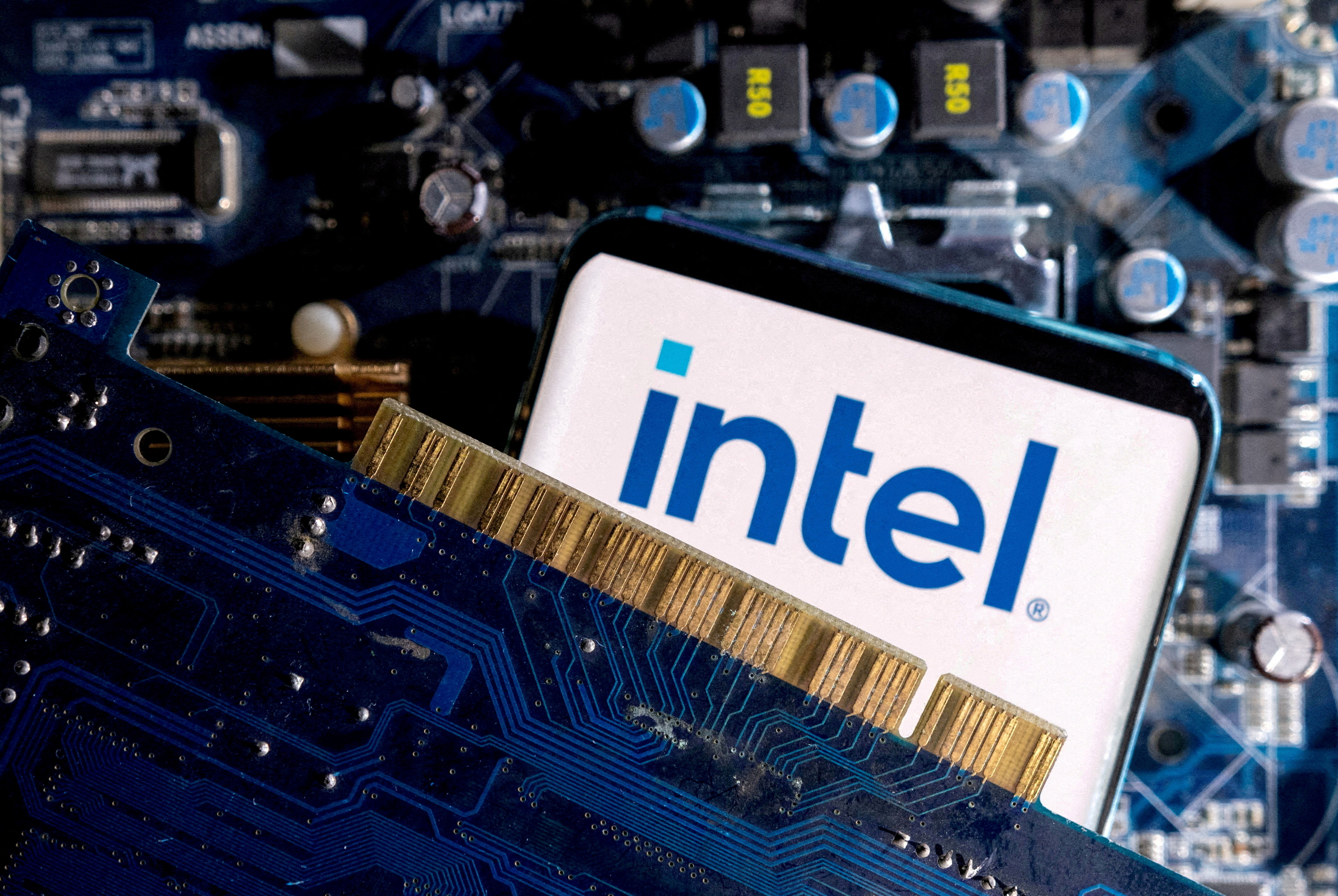 Illustration shows a smartphone with a displayed Intel logo