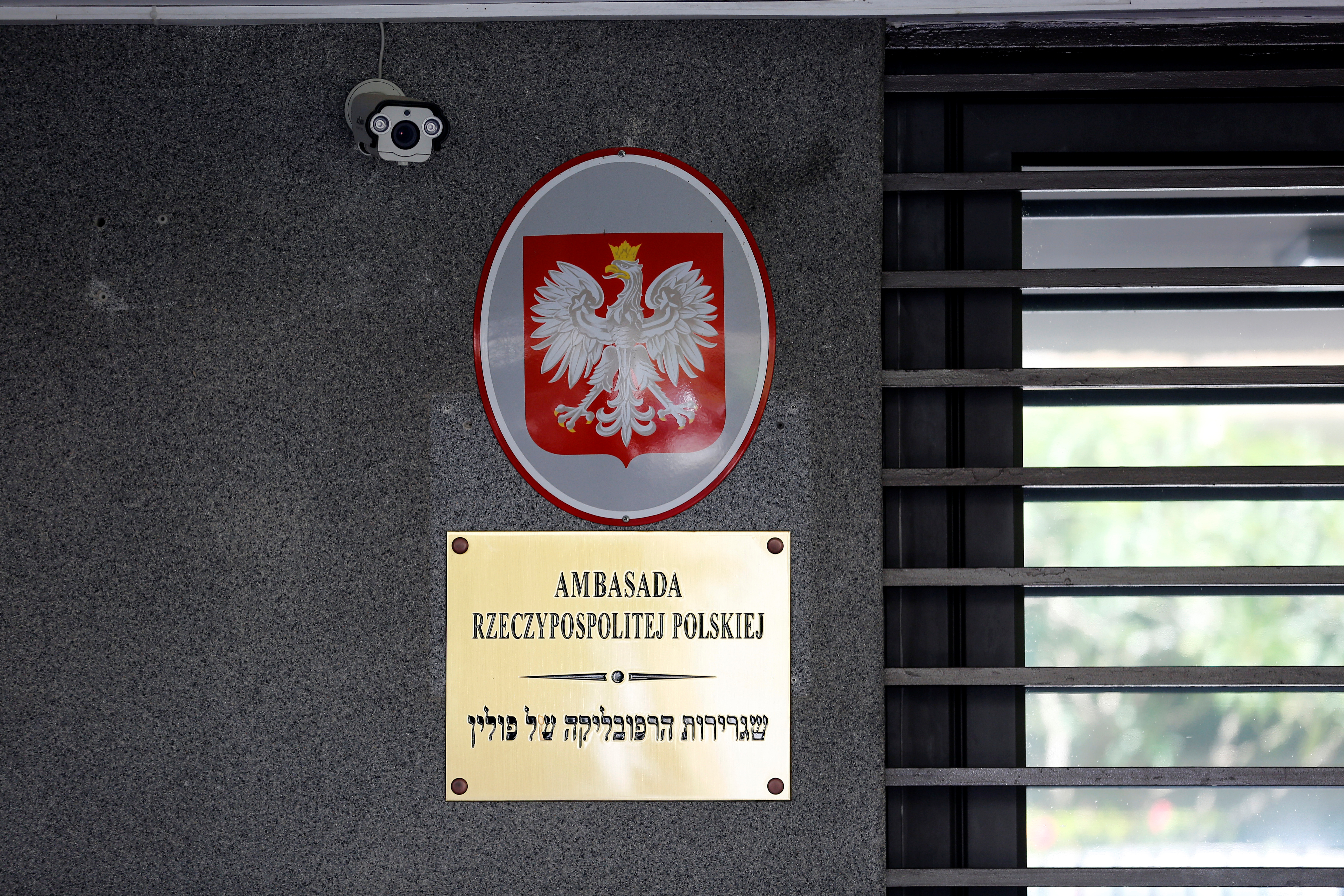 Signage is seen at the entrance of the Polish Embassy in Tel Aviv, Israel
