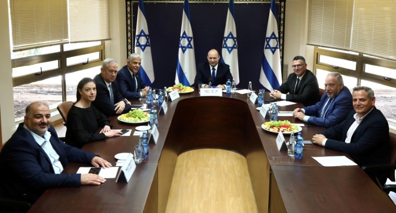 Party leaders of the proposed new coalition government, pose for a picture at the Knesset, Israel's parliament, before the start of a special session to approve and swear-in the coalition government, in Jerusalem