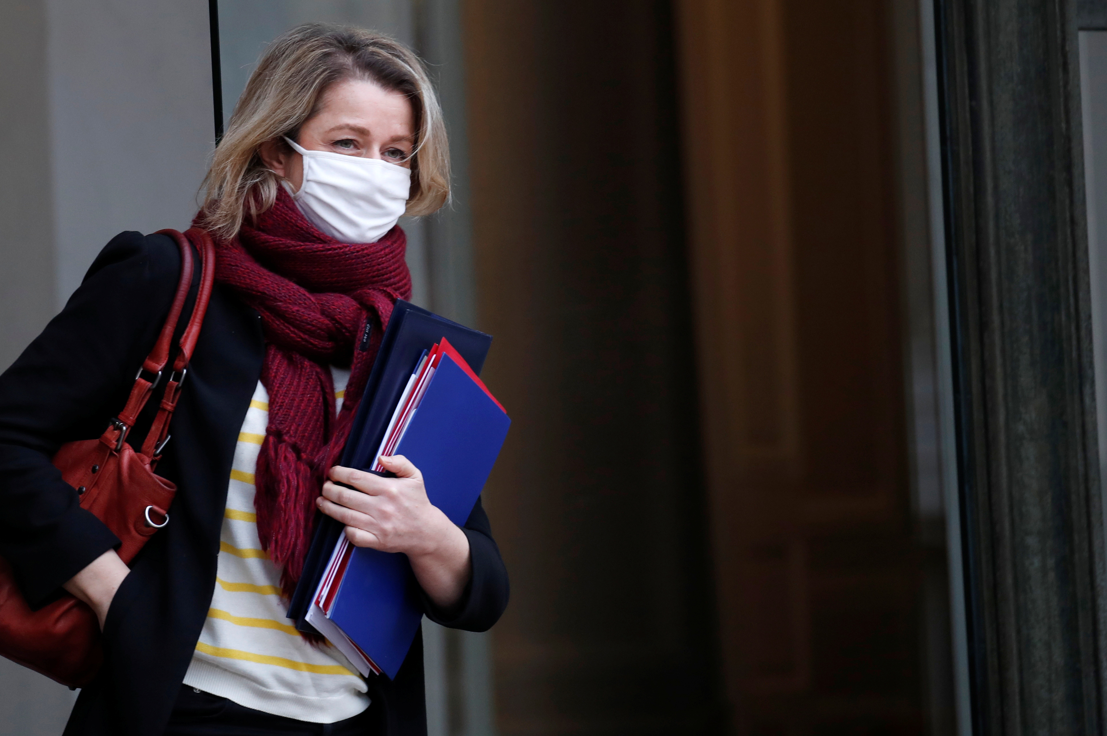 French Ecological Transition Minister Barbara Pompili, wearing a protective face mask, leaves following the weekly cabinet meeting at the Elysee Palace in Paris, France January 27, 2021. REUTERS/Gonzalo Fuentes