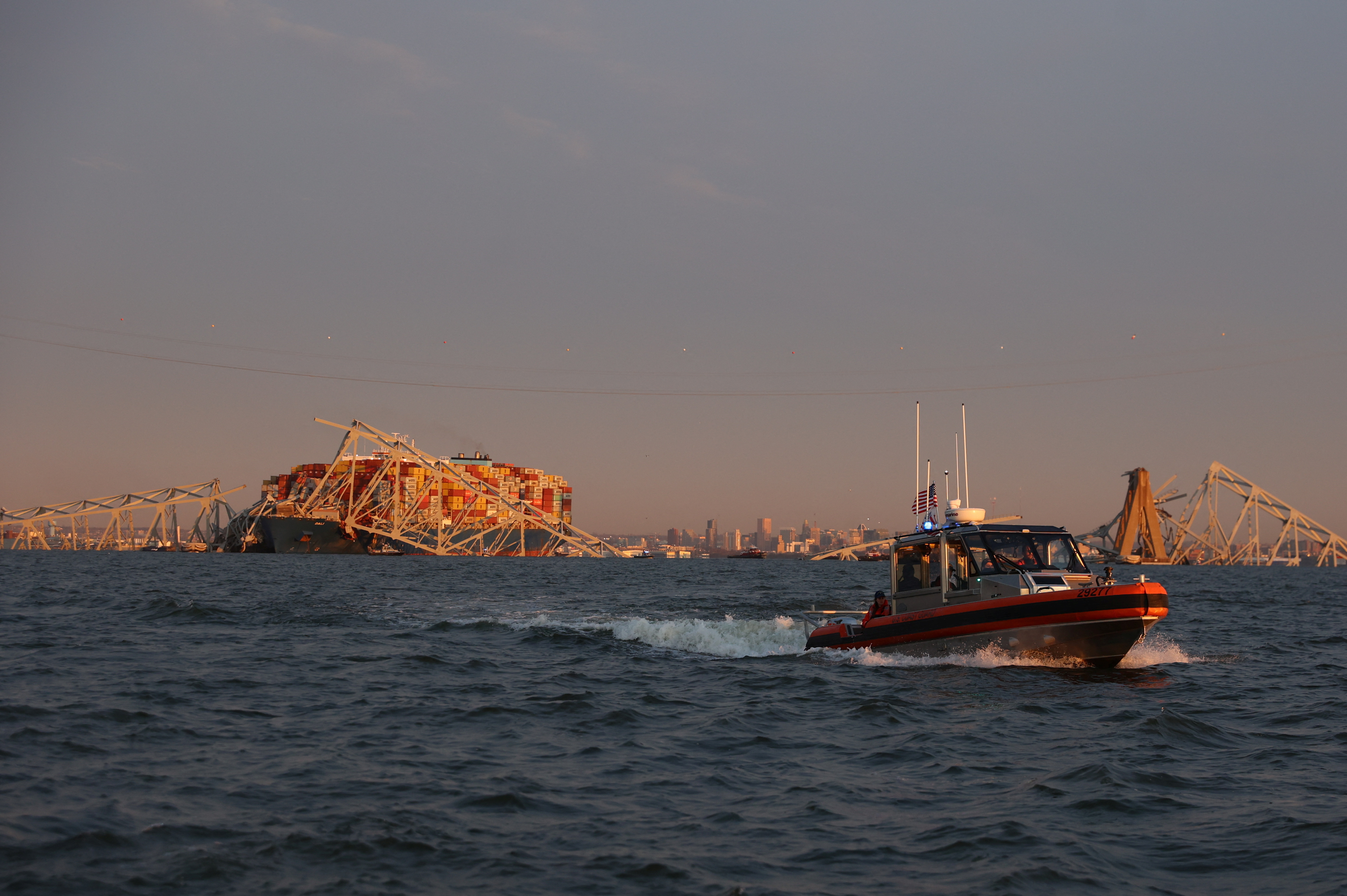 Emergency personnel work at the scene of the Francis Scott Key Bridge collapse in Baltimore