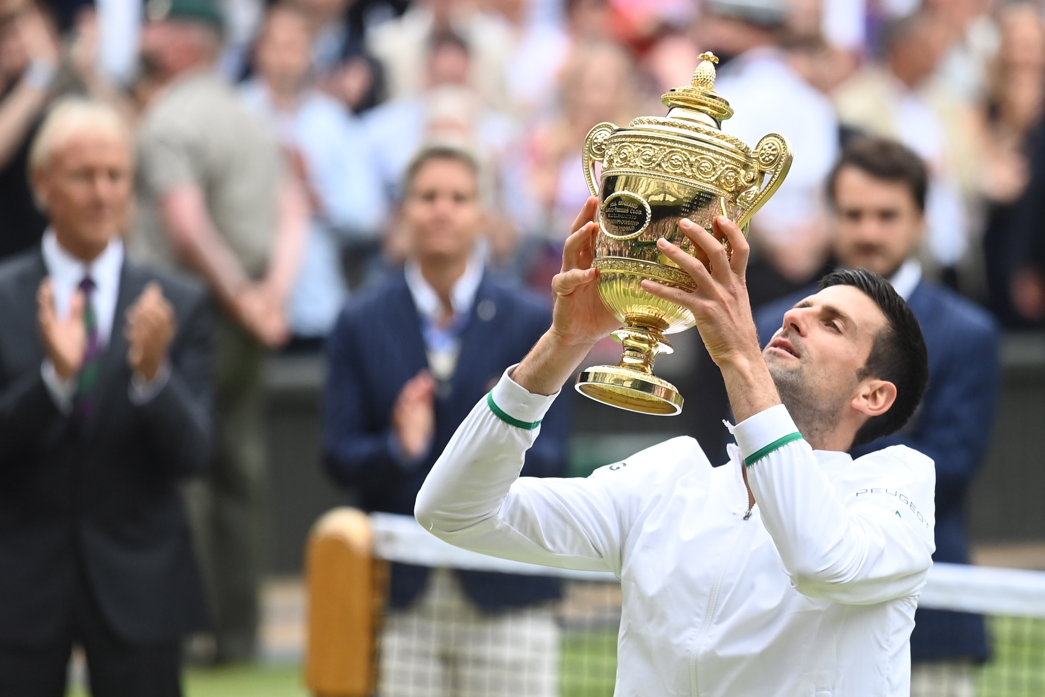 Djokovic triumphs at Wimbledon to secure recordequalling 20th major