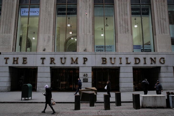 People walk outside 40 Wall Street, also known as the Trump Building, in the Manhattan borough of New York