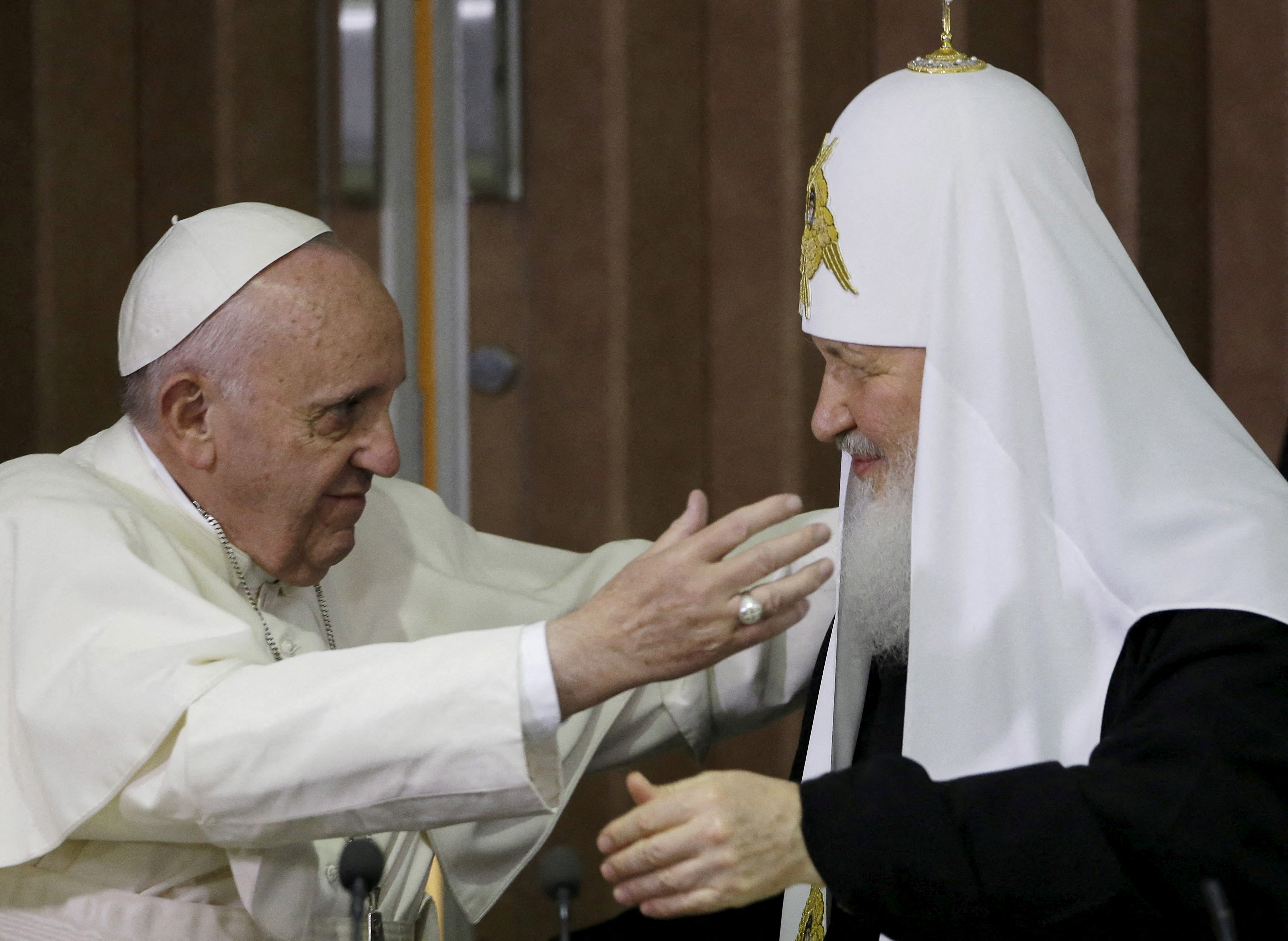 Pope Francis, left, reaches to embrace Russian Orthodox Patriarch Kirill after signing a joint declaration at the Jose Marti International airport in Havana