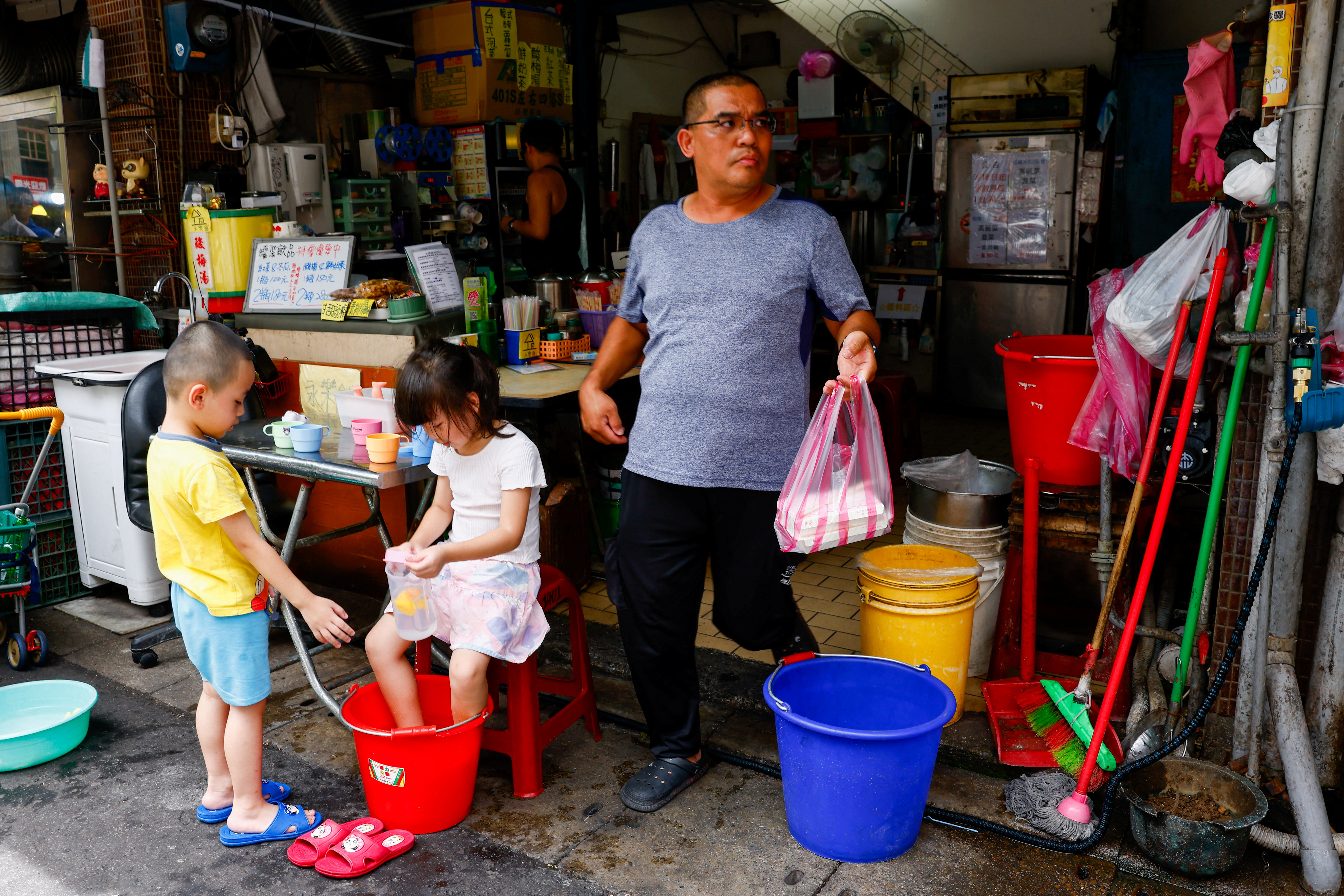 People buy lunch as typhoon Gaemi is expected to make landfall on Wednesday night in Taipei