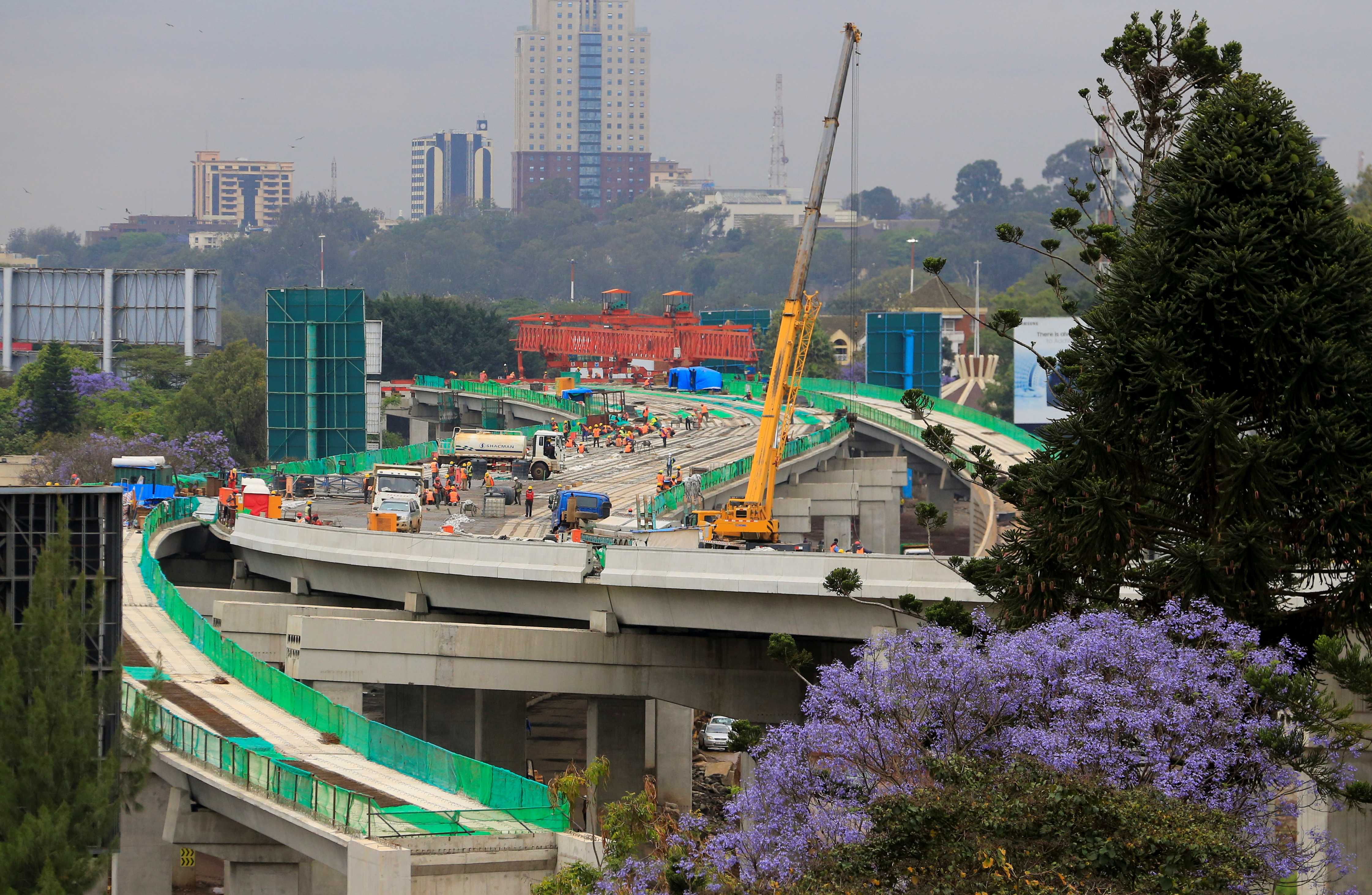 Workers are seen on site during the construction of the Nairobi Expressway, in Nairobi