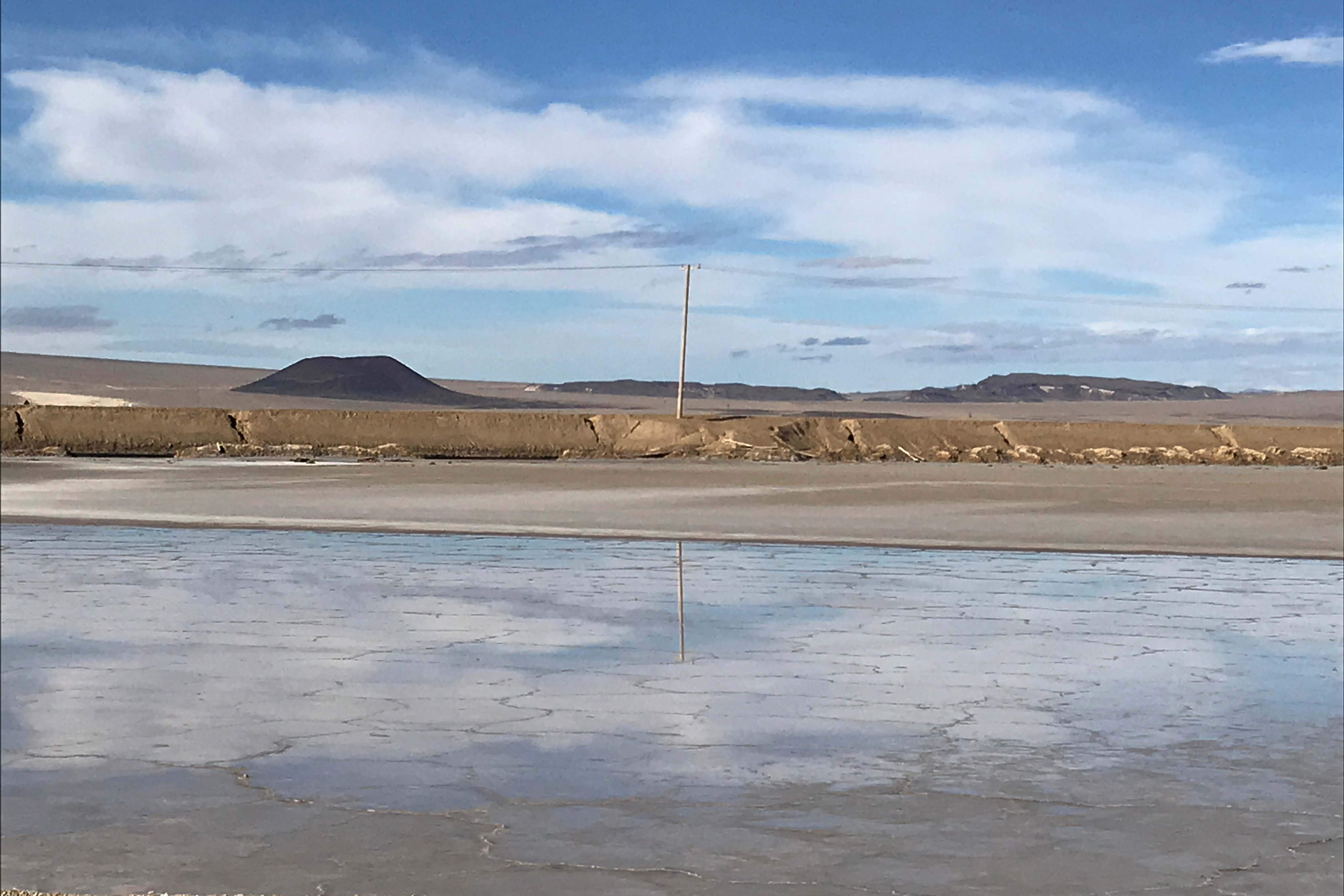 One of Albemarle's lithium evaporation ponds reflects the sky at its facility in Silver Peak