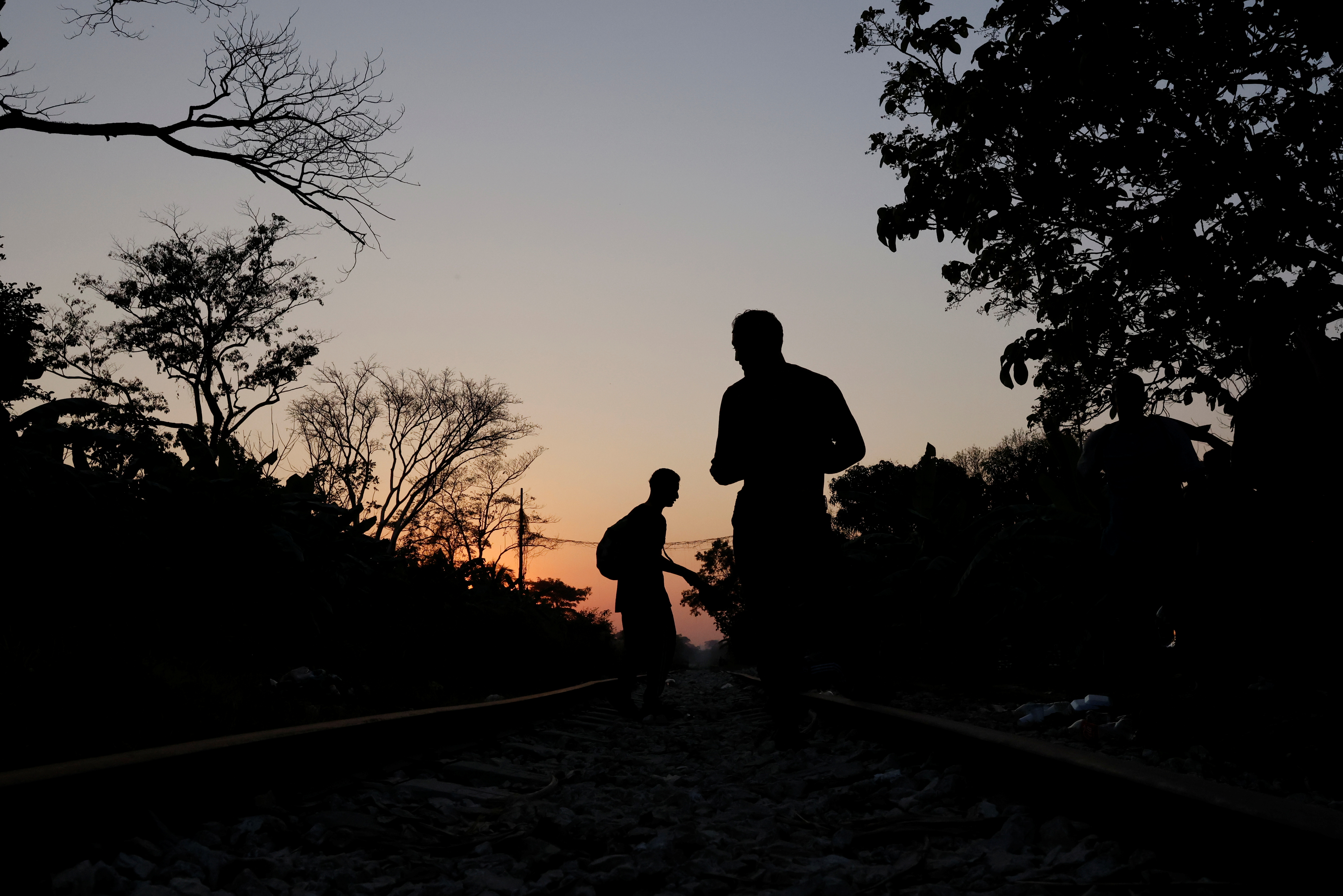 A group of Central American migrants rest along the railway track on their way to the United States in Macuspana, Tabasco, Mexico March 25, 2021. REUTERS/Carlos Jasso