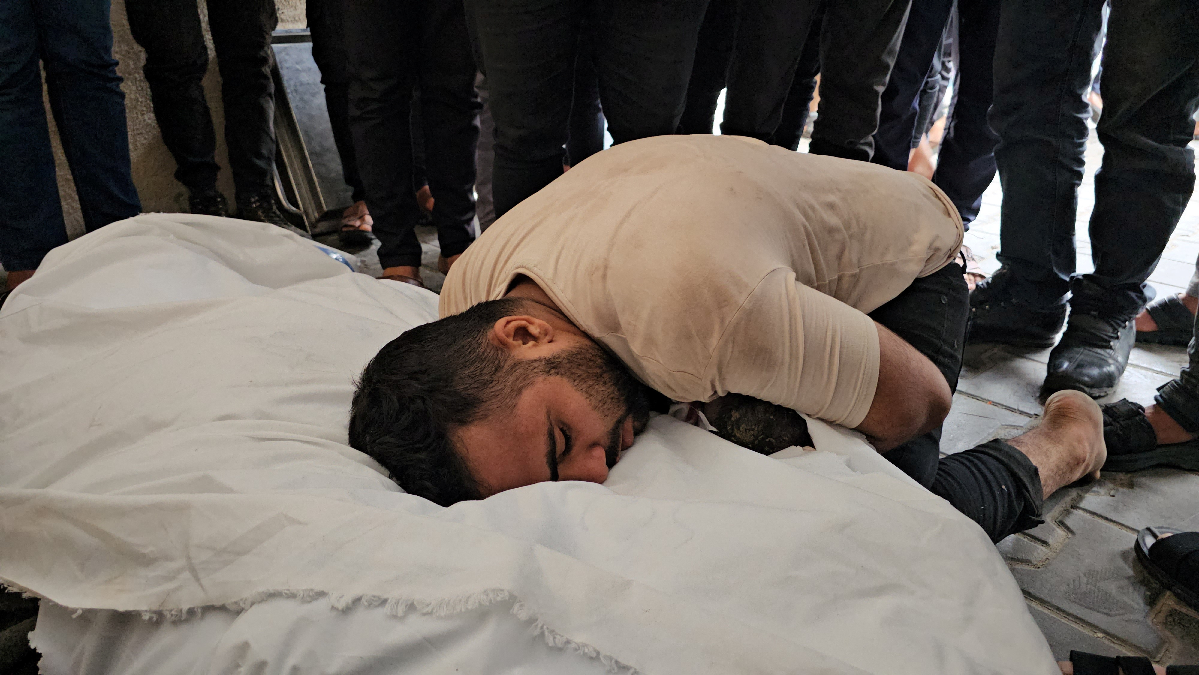 Gaza man mourns his stillborn girl and pregnant wife killed in Israeli strike