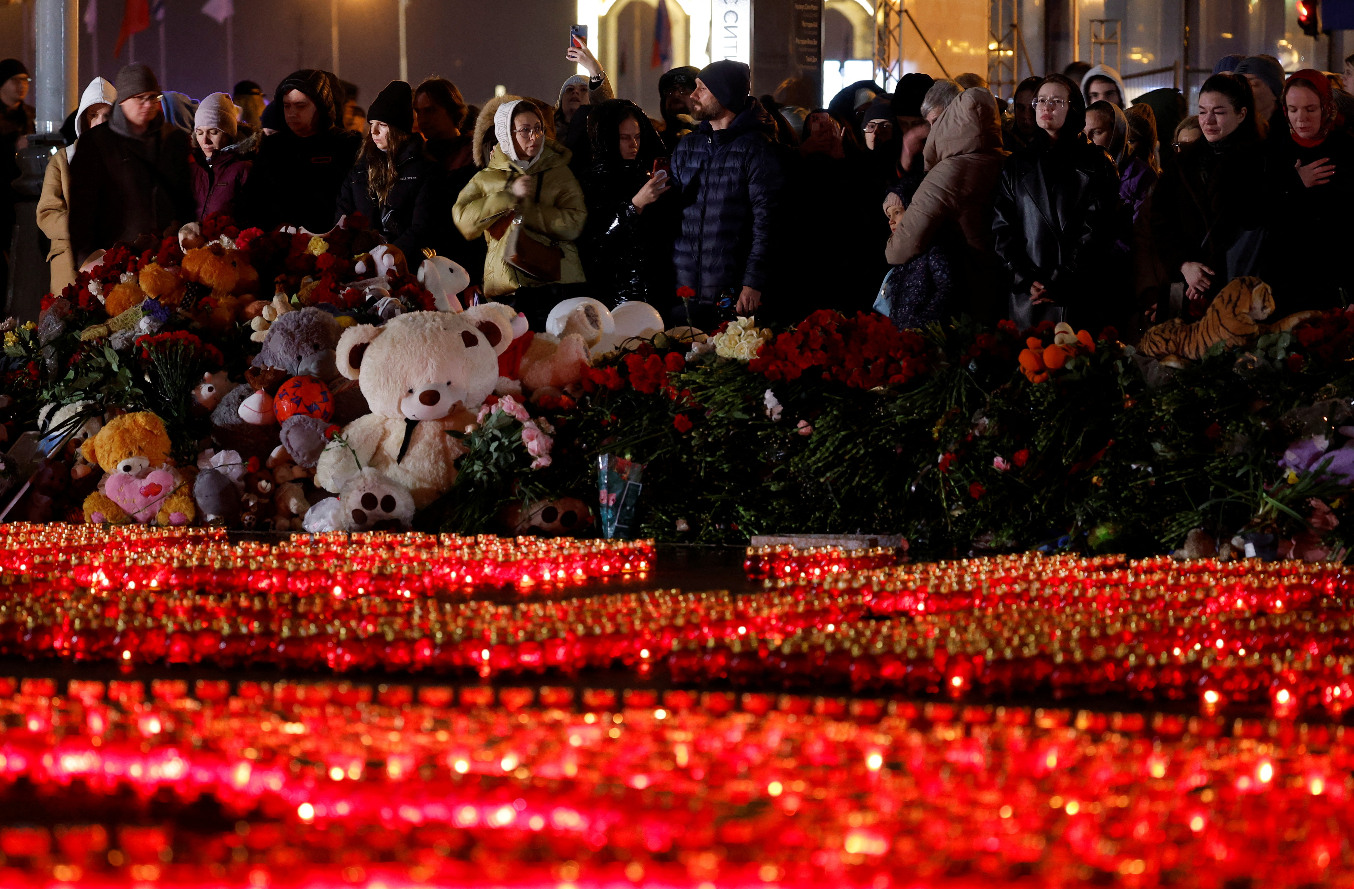 People hold a vigil to honour victims of the Crocus City Hall attack in Moscow Region