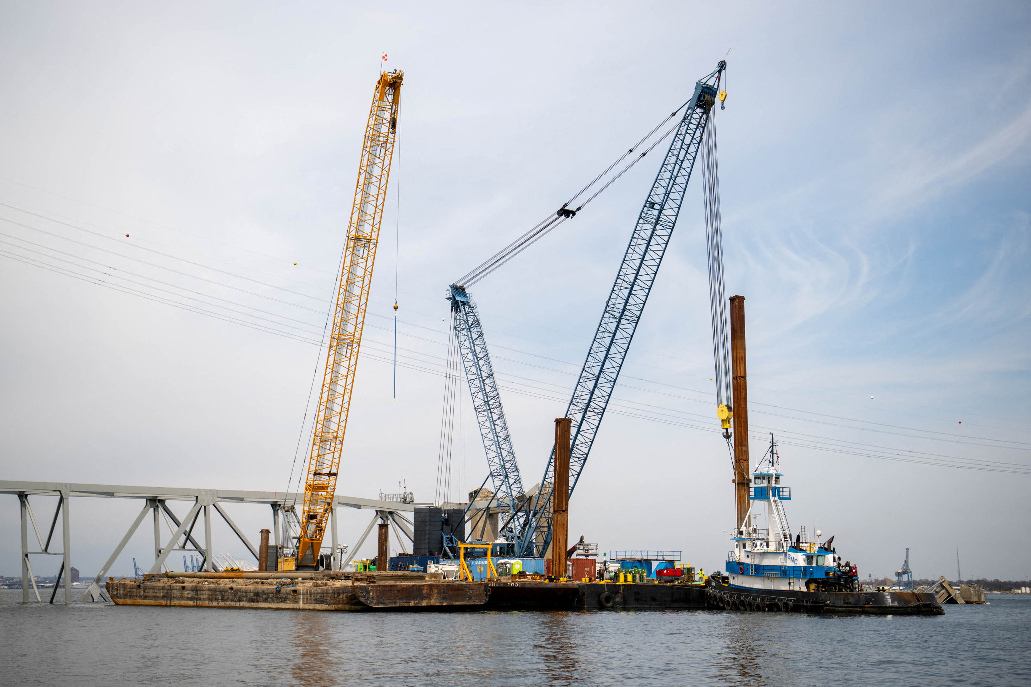Barge cranes are shown near the collapsed Francis Scott Key Bridge in Baltimore