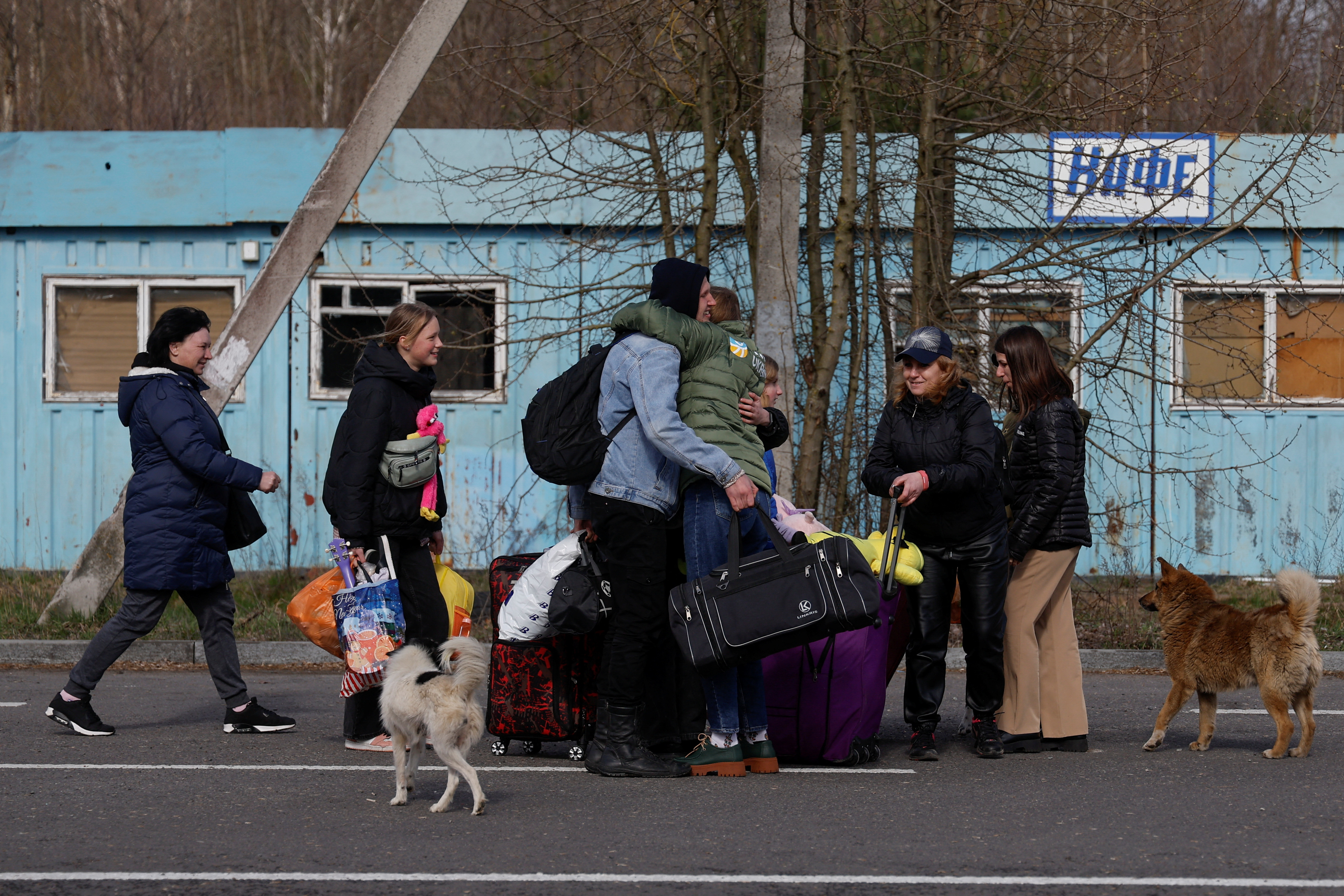 Volunteers welcome women and their children, taken to Russia, after tey returned via the Ukraine-Belarus border, in Volyn region