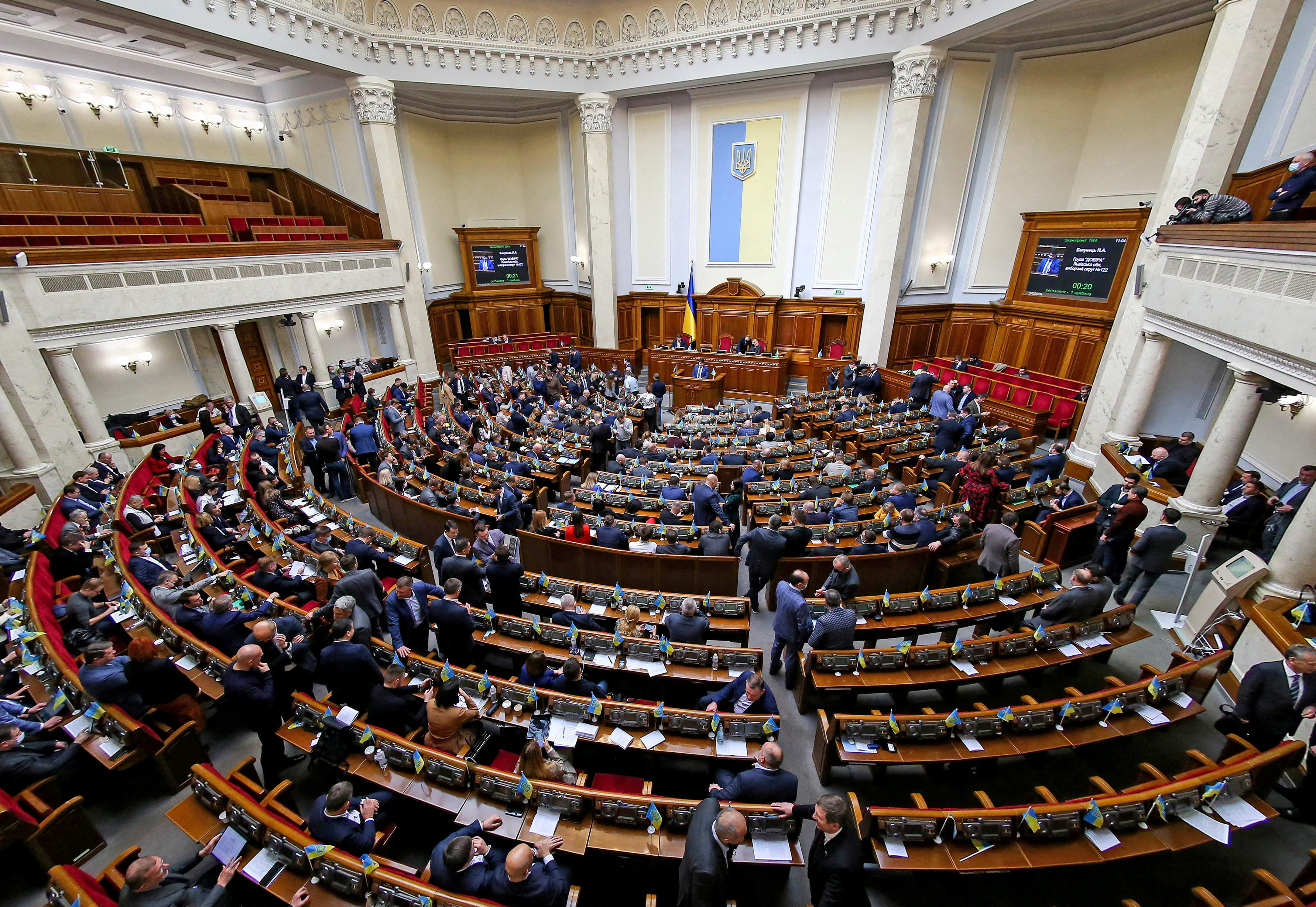 Ukrainian lawmakers attend a session of parliament in Kyiv
