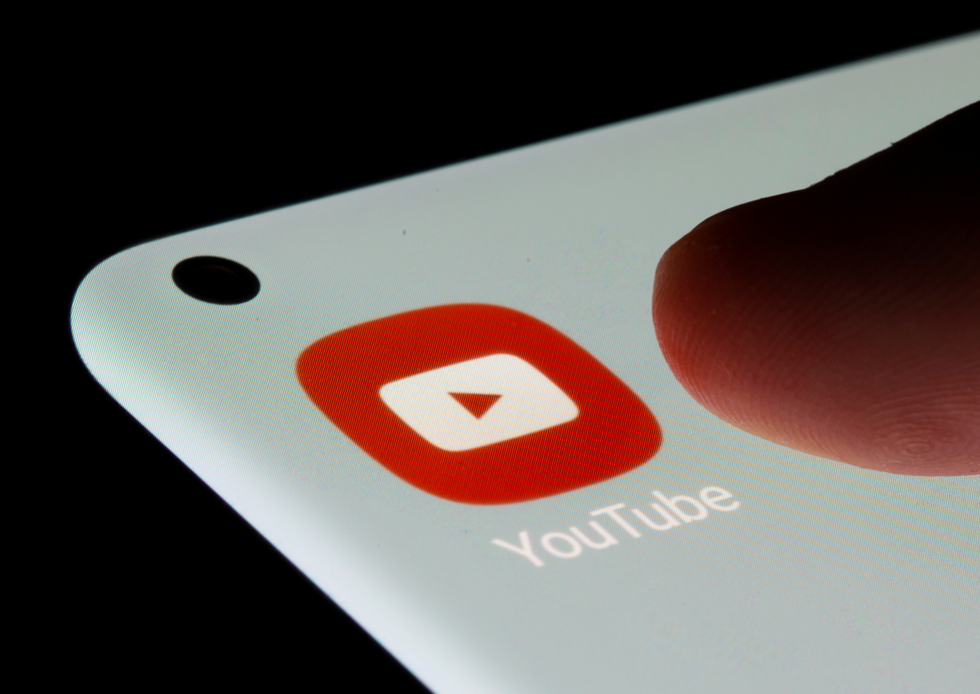 YouTube app is seen on a smartphone in this illustration