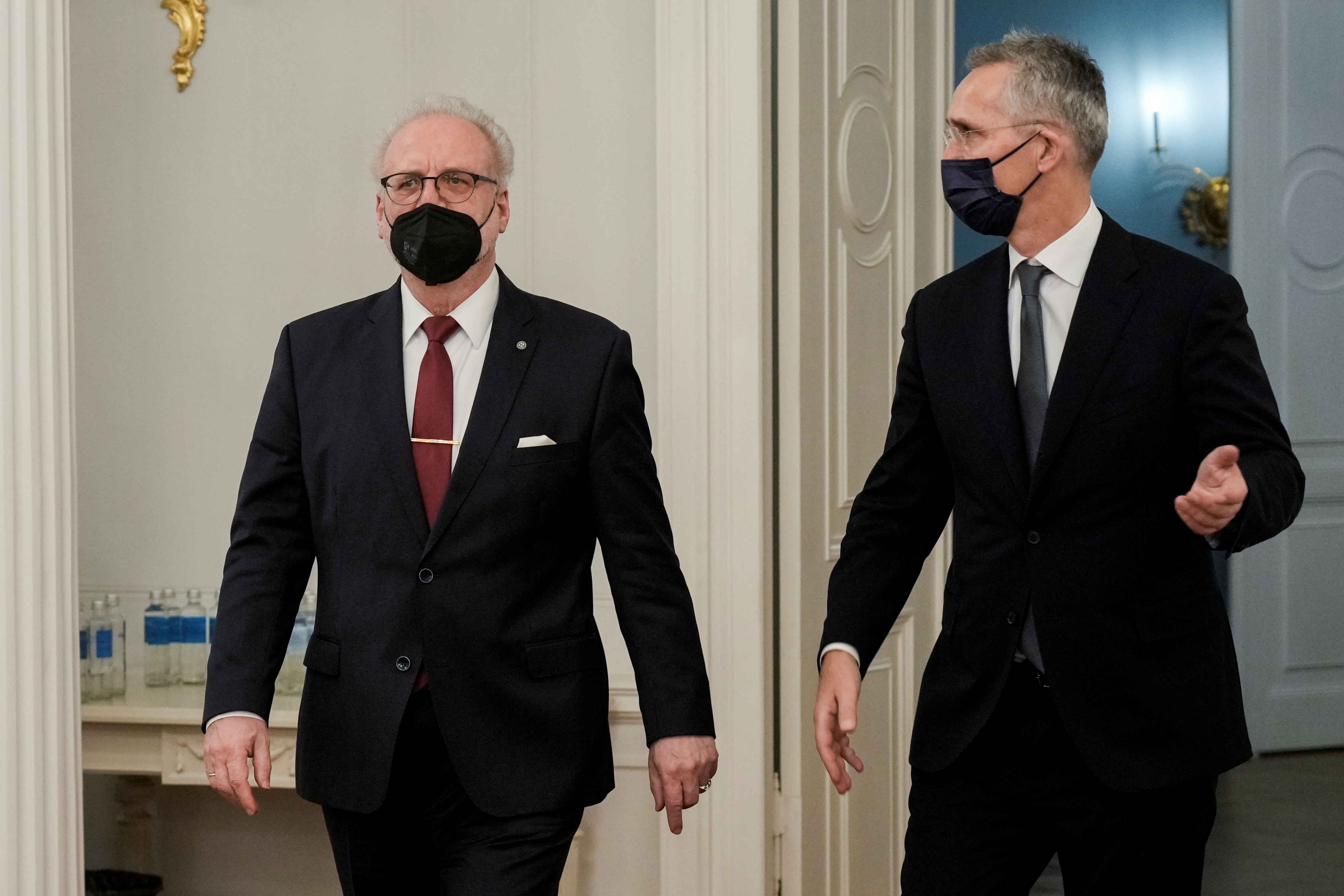 Latvian President Egils Levits and NATO Secretary General Jens Stoltenberg arrive for a news conference in Riga, Latvia November 29, 2021. REUTERS/Ints Kalnins