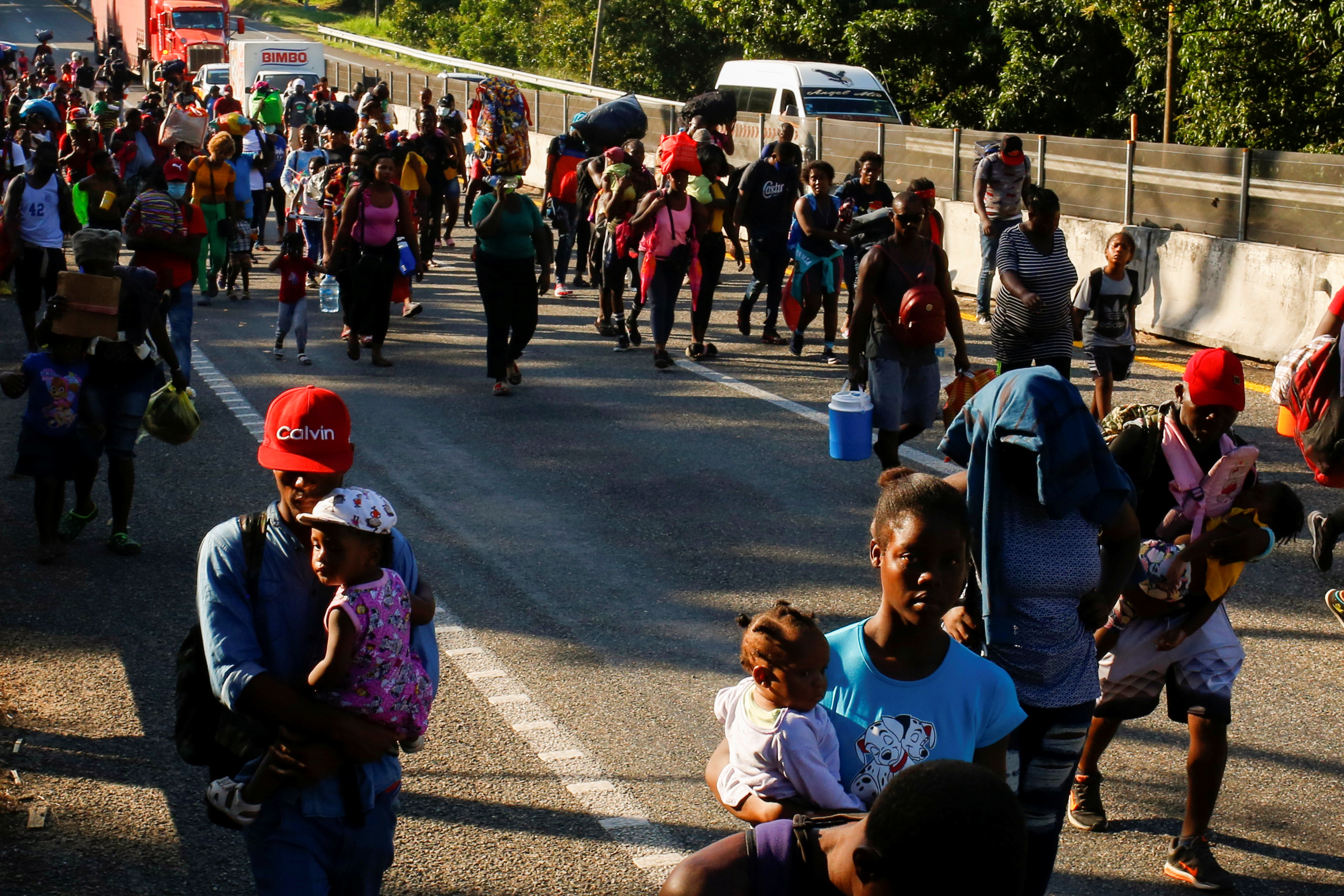 Migrants walk as they take part in a caravan heading to the U.S. border, near Huehuetan, Mexico November 29, 2021. REUTERS/Jose Luis Gonzalez