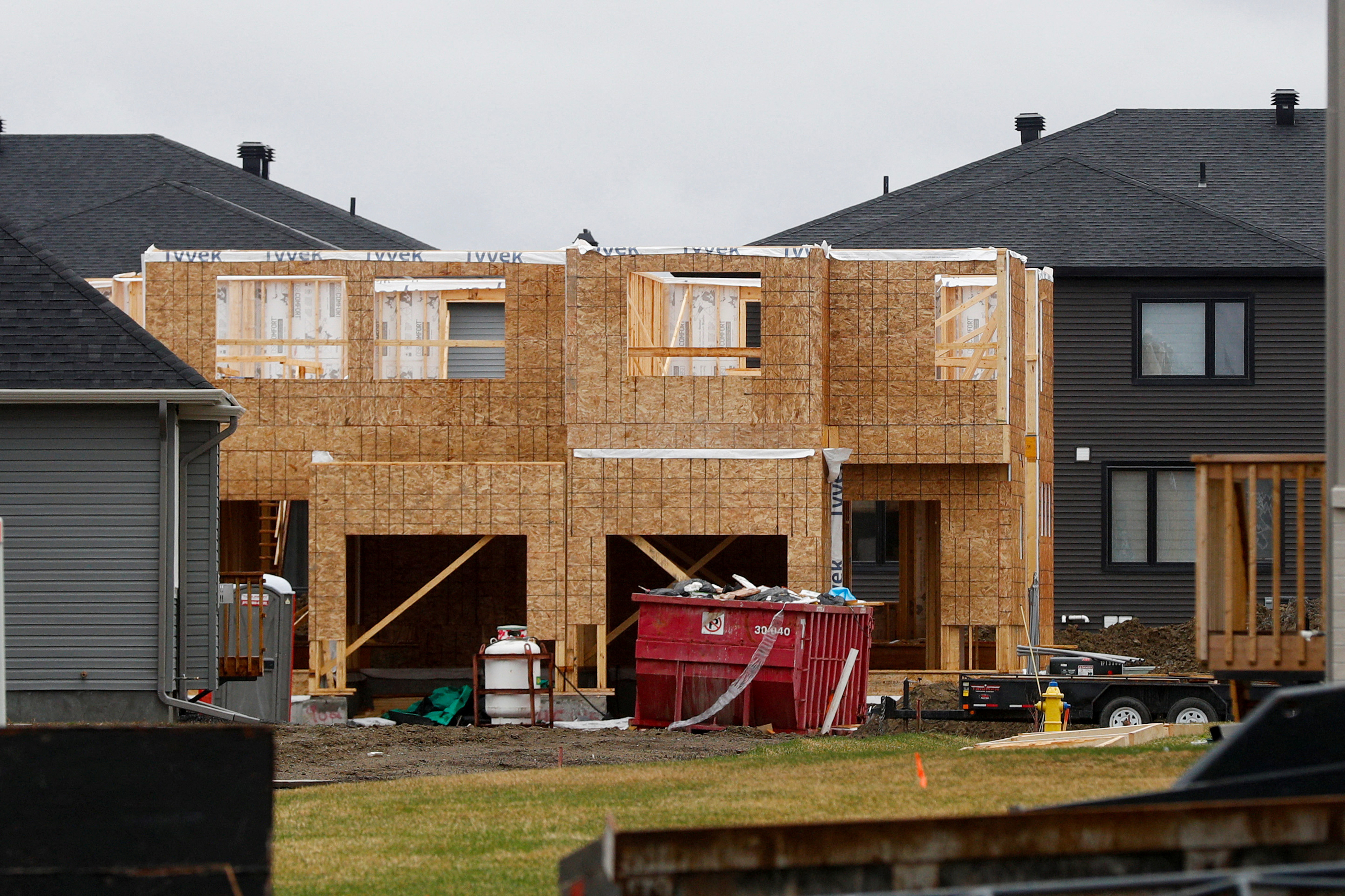 Houses are seen for sale and under construction in a neighbourhood of Ottawa