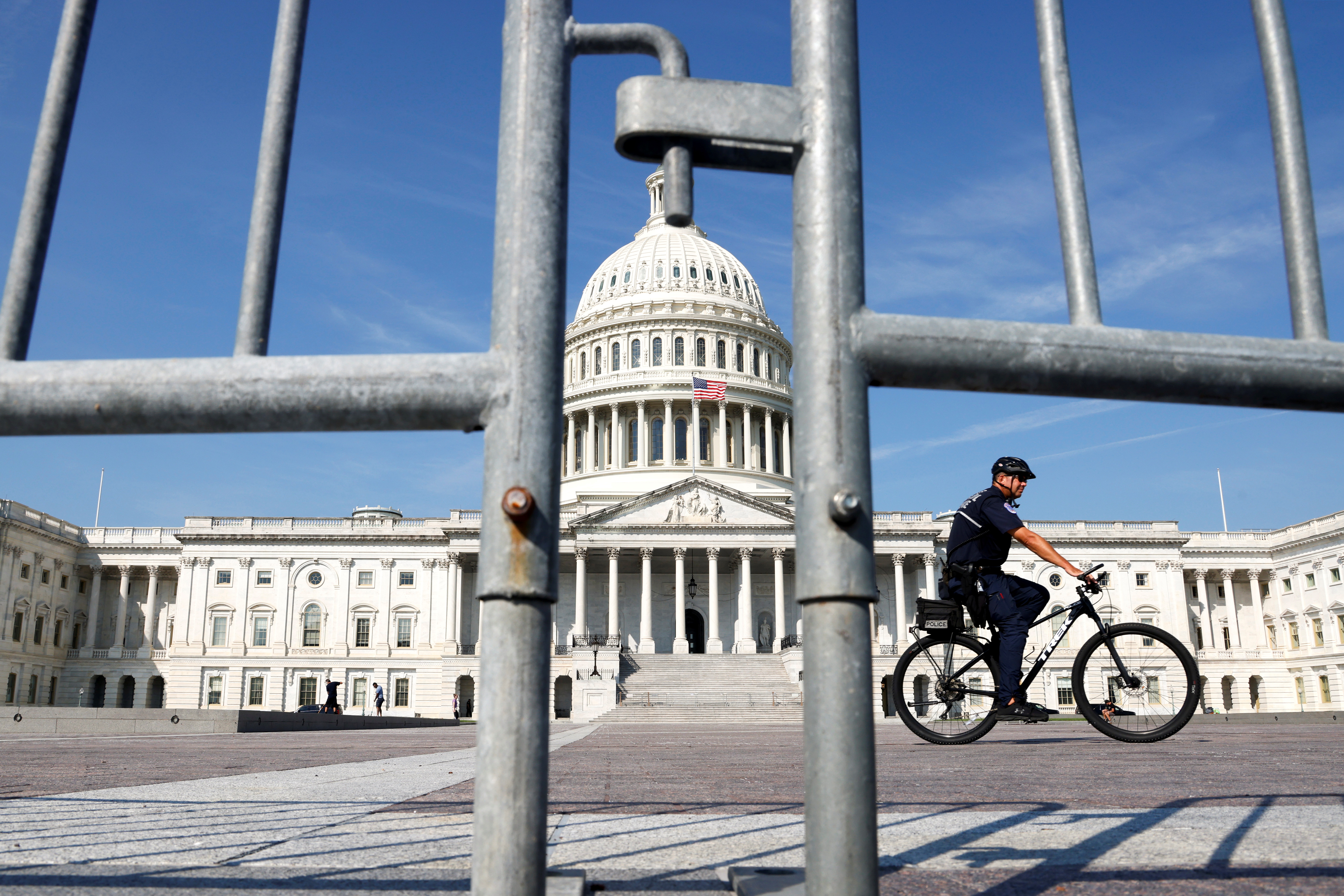 A U.S. Capitol Police officer patrols the east front of the U.S. Capitol in Washington, U.S. September 15, 2021.  REUTERS/Jonathan Ernst