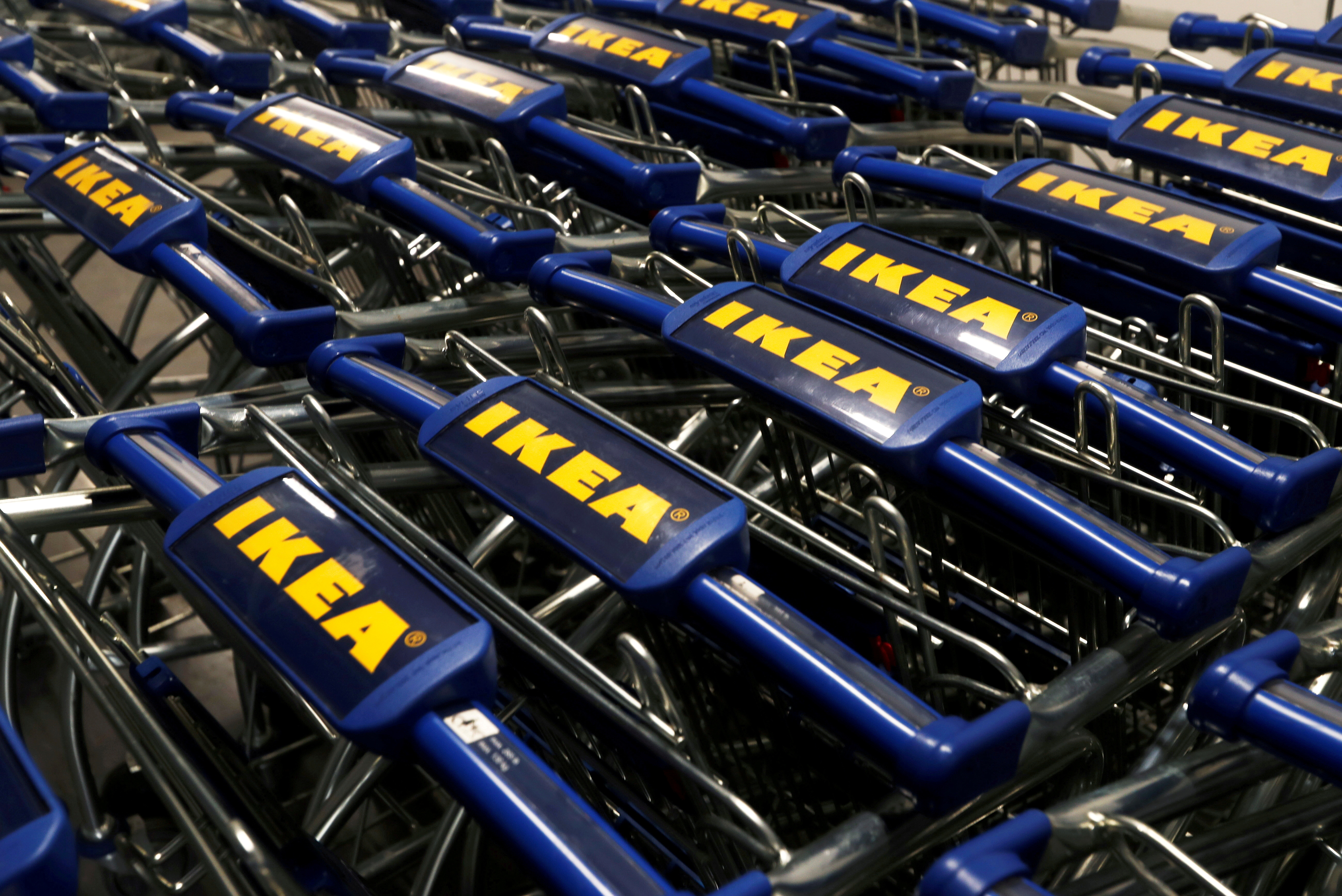The IKEA logo is seen on shopping carts inside the new IKEA store in Navi Mumbai