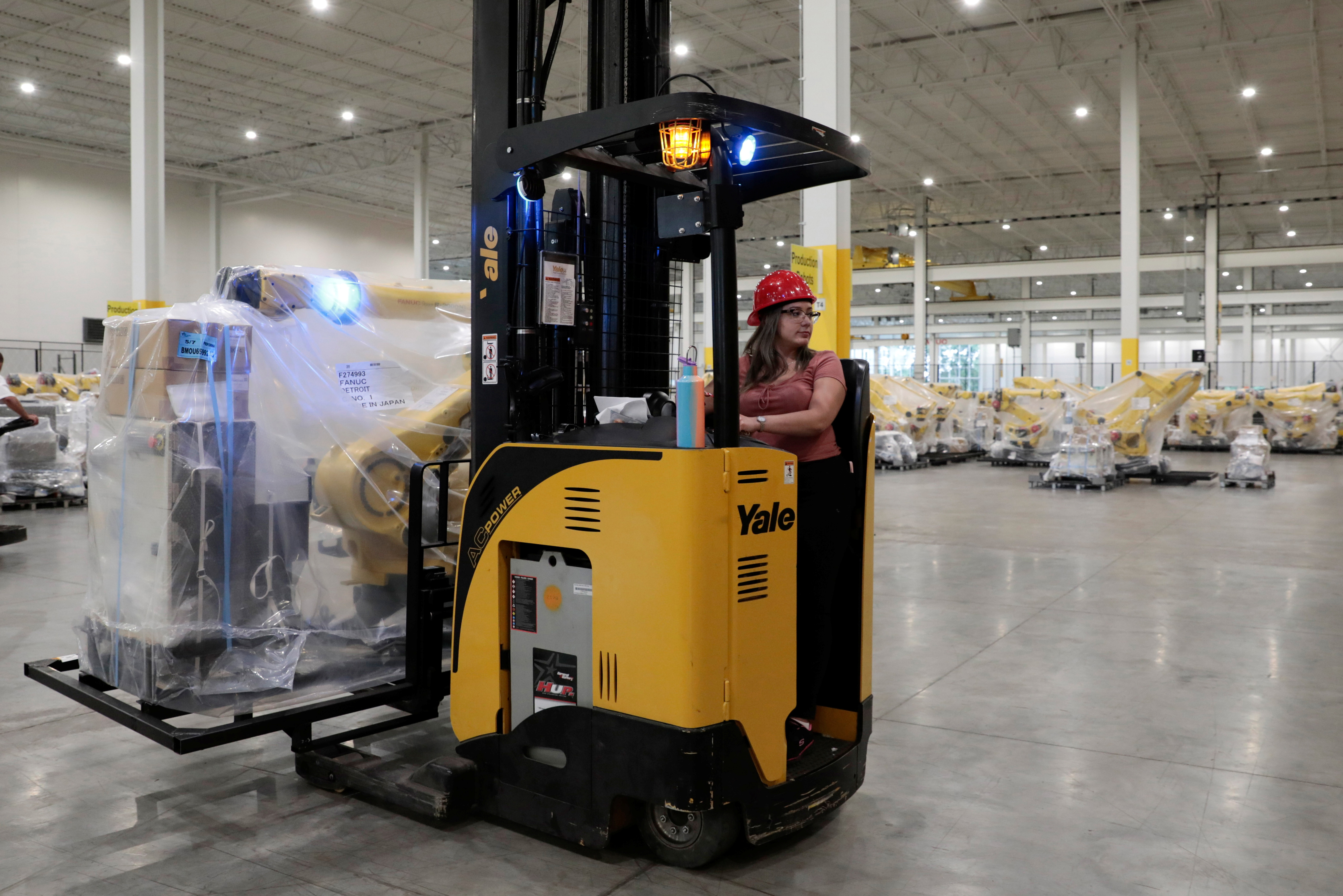 An inventory of manufacturing robots, waiting to be shipped to customers are seen in a FANUC American facility