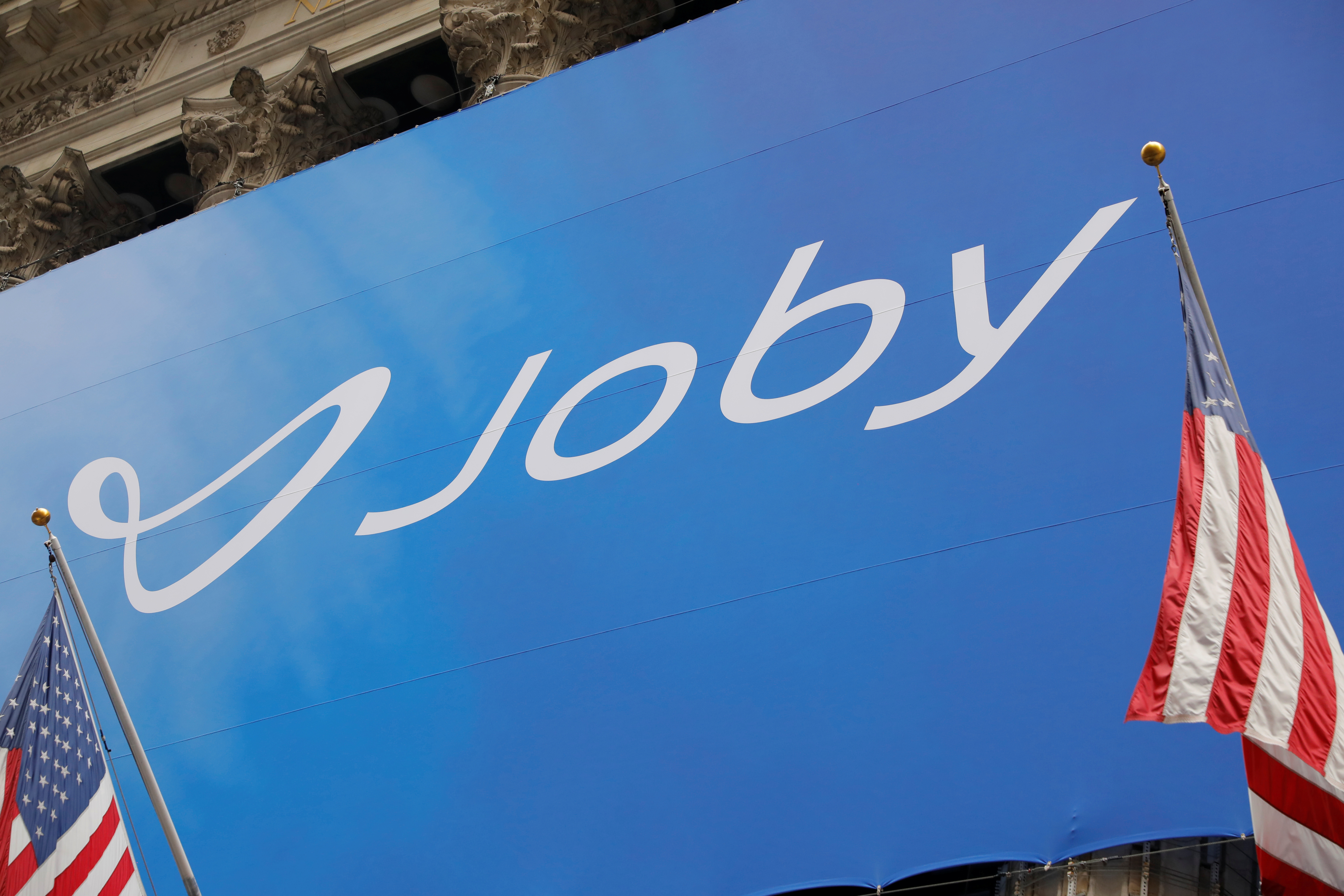 The Joby Aviation logo is seen outside of the New York Stock Exchange (NYSE) ahead of their listing in Manhattan, New York City
