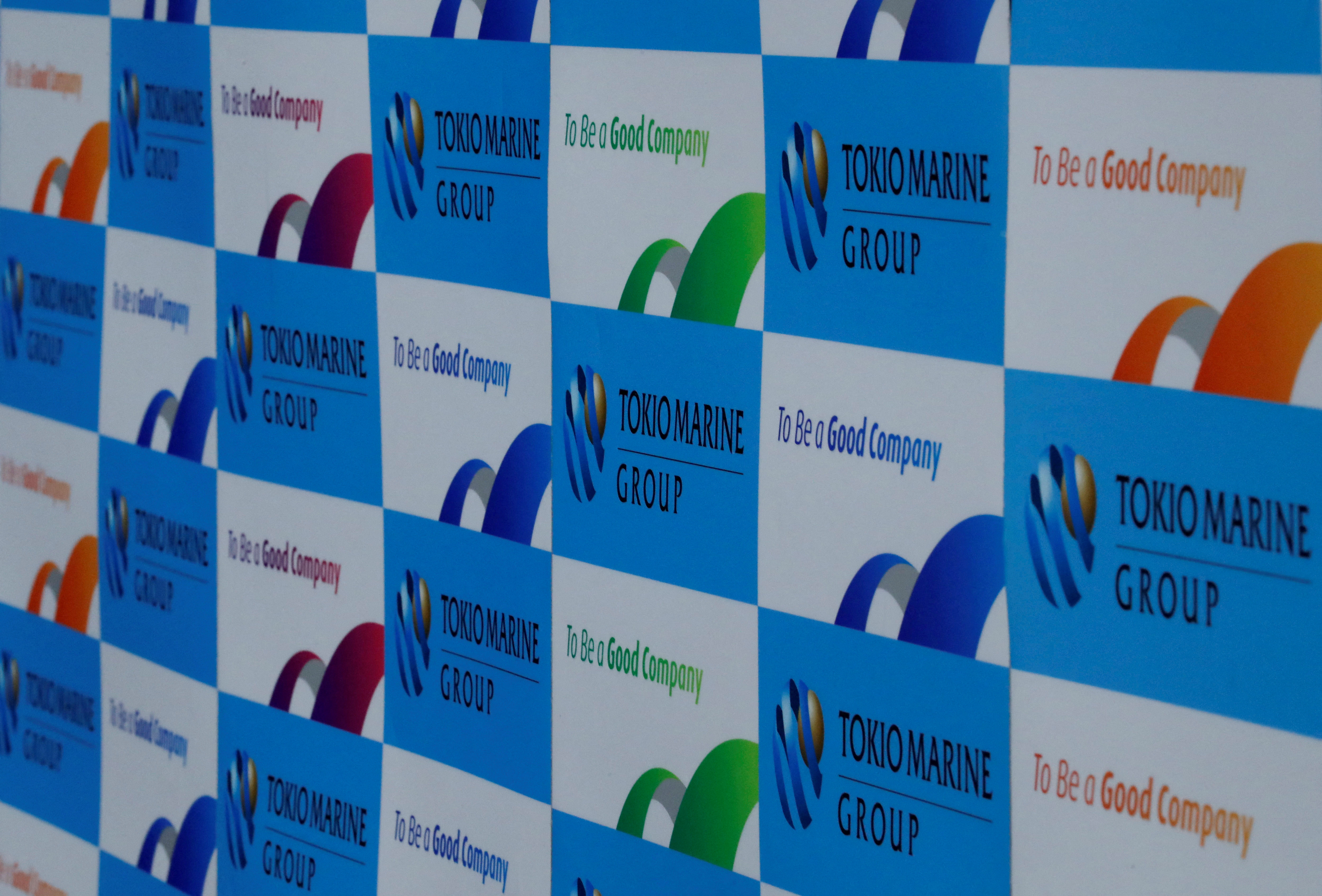 Logos of Tokio Marine Holdings Inc are pictured at a news conference in Tokyo