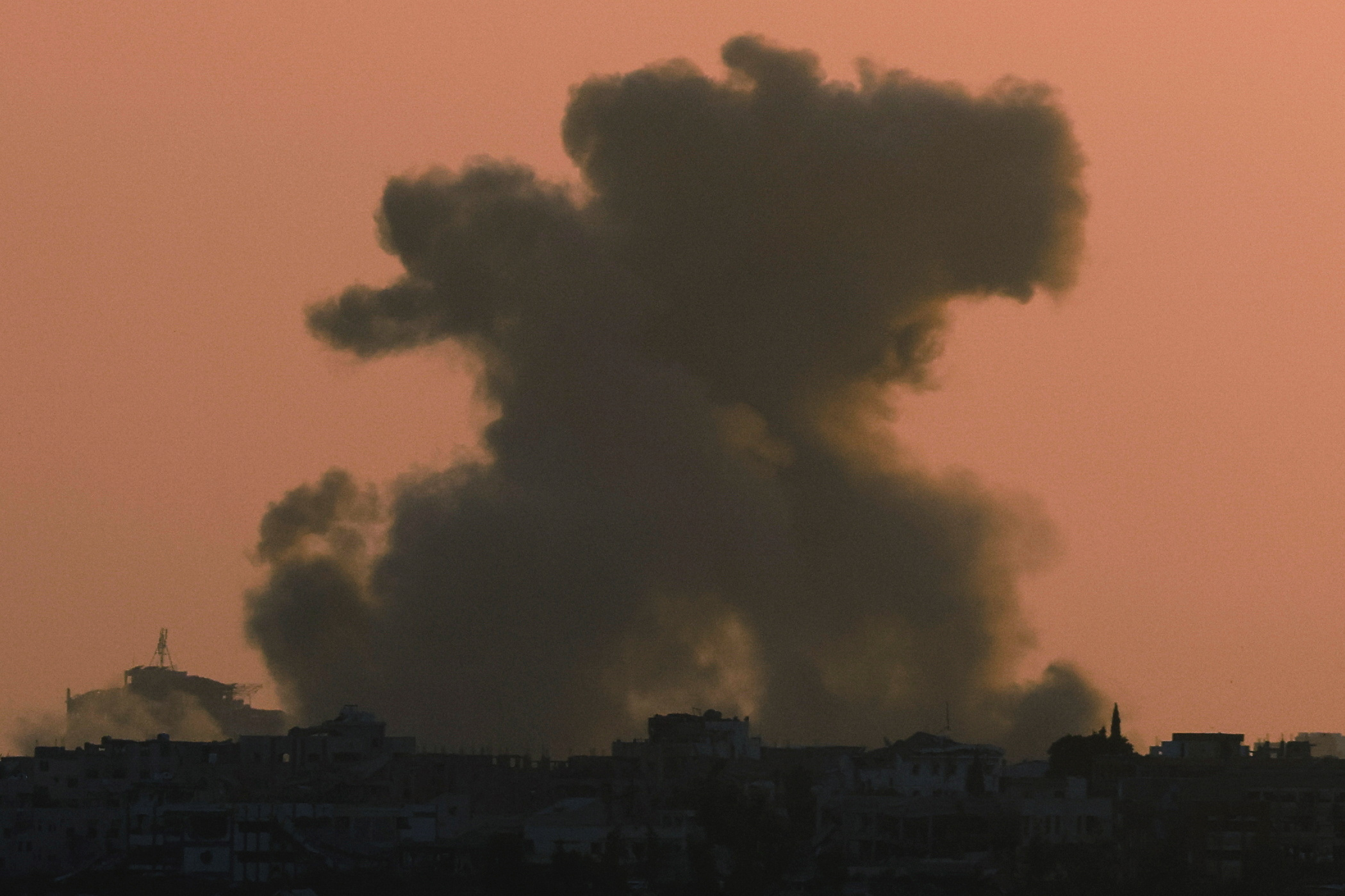 Smoke billows after an explosion in northern Gaza