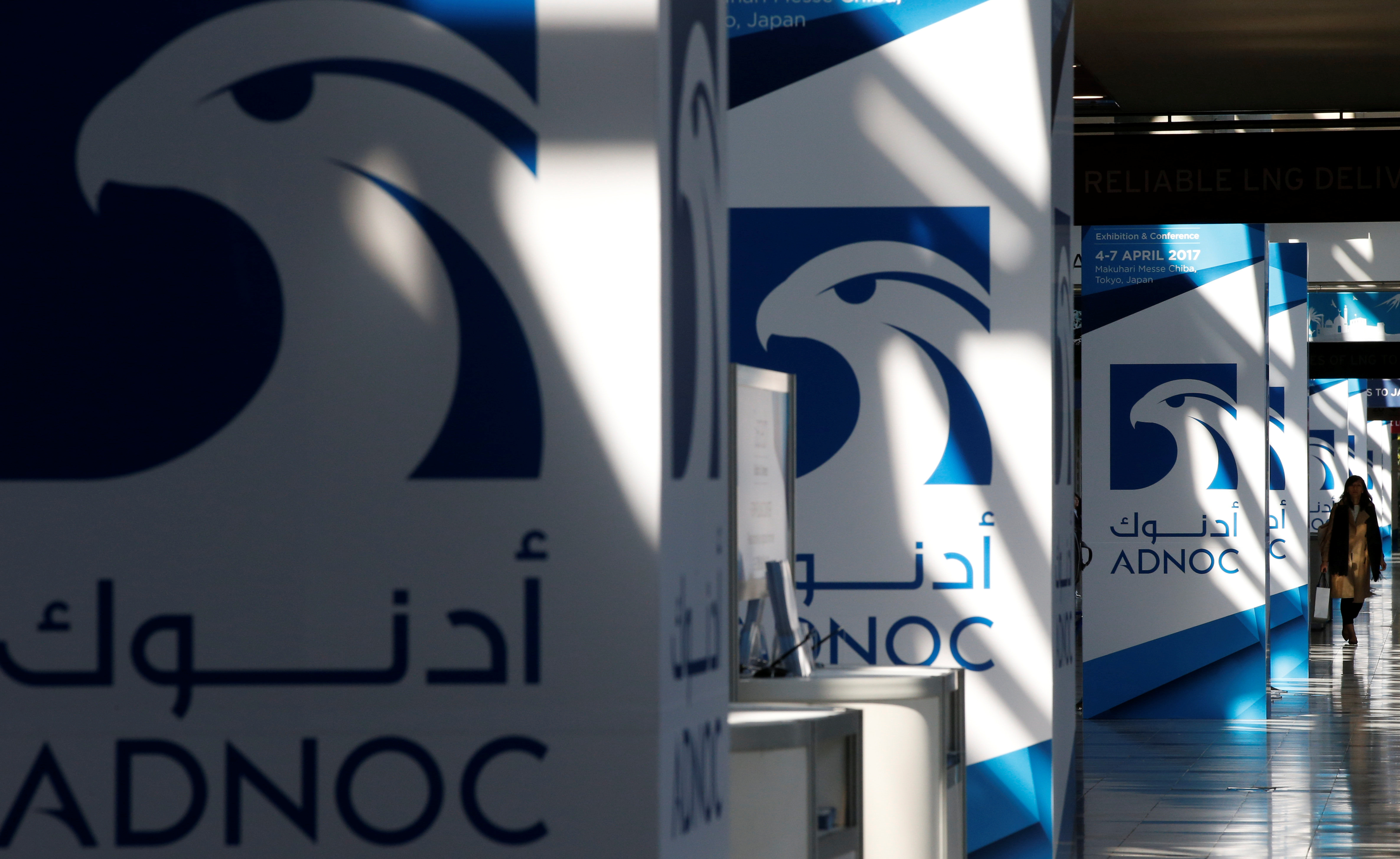 Logos of ADNOC are seen at Gastech, the world's biggest expo for the gas industry, in Chiba