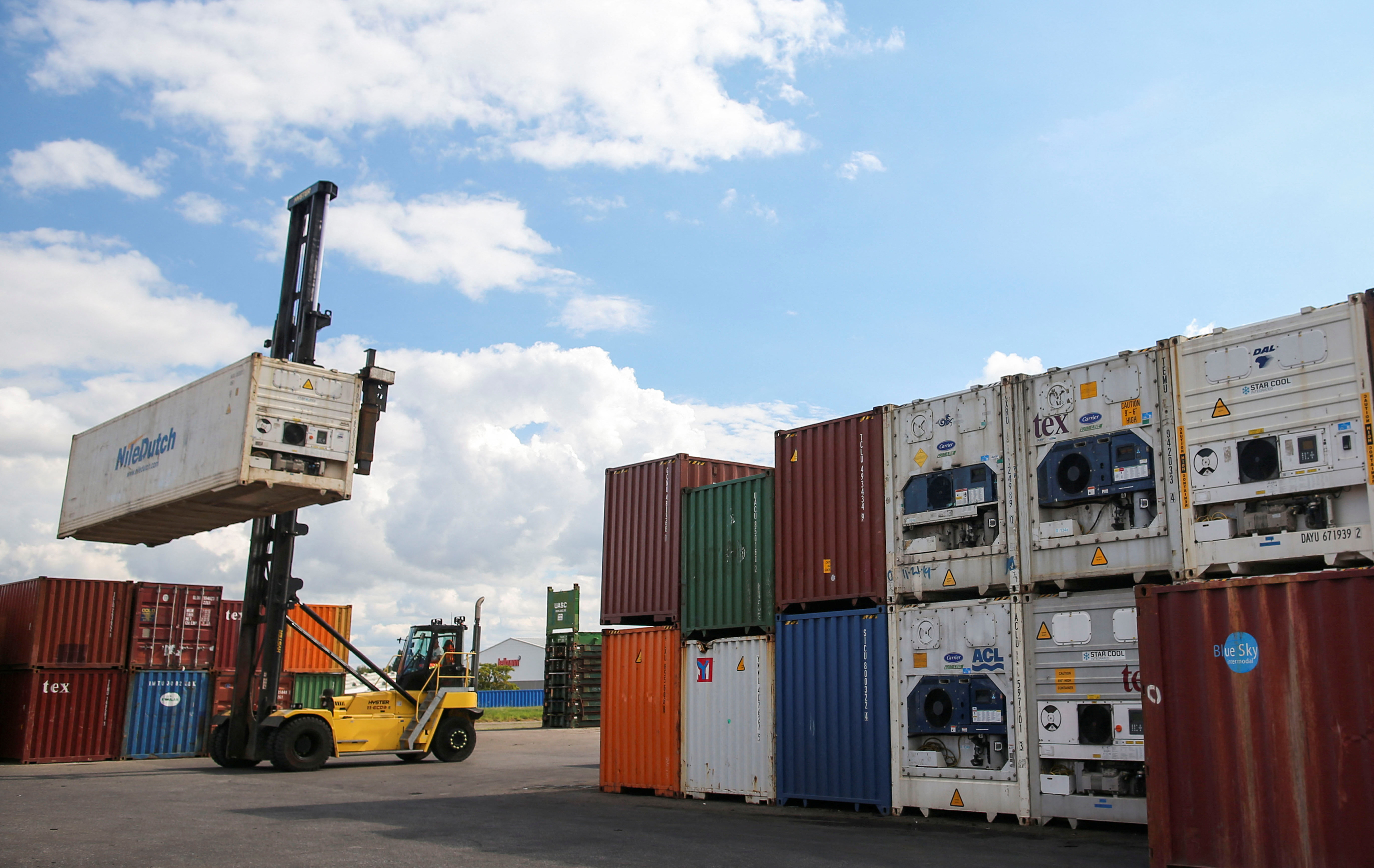 Containers are piled up at the Hapag-Lloyd shipping company in the port of Hamburg