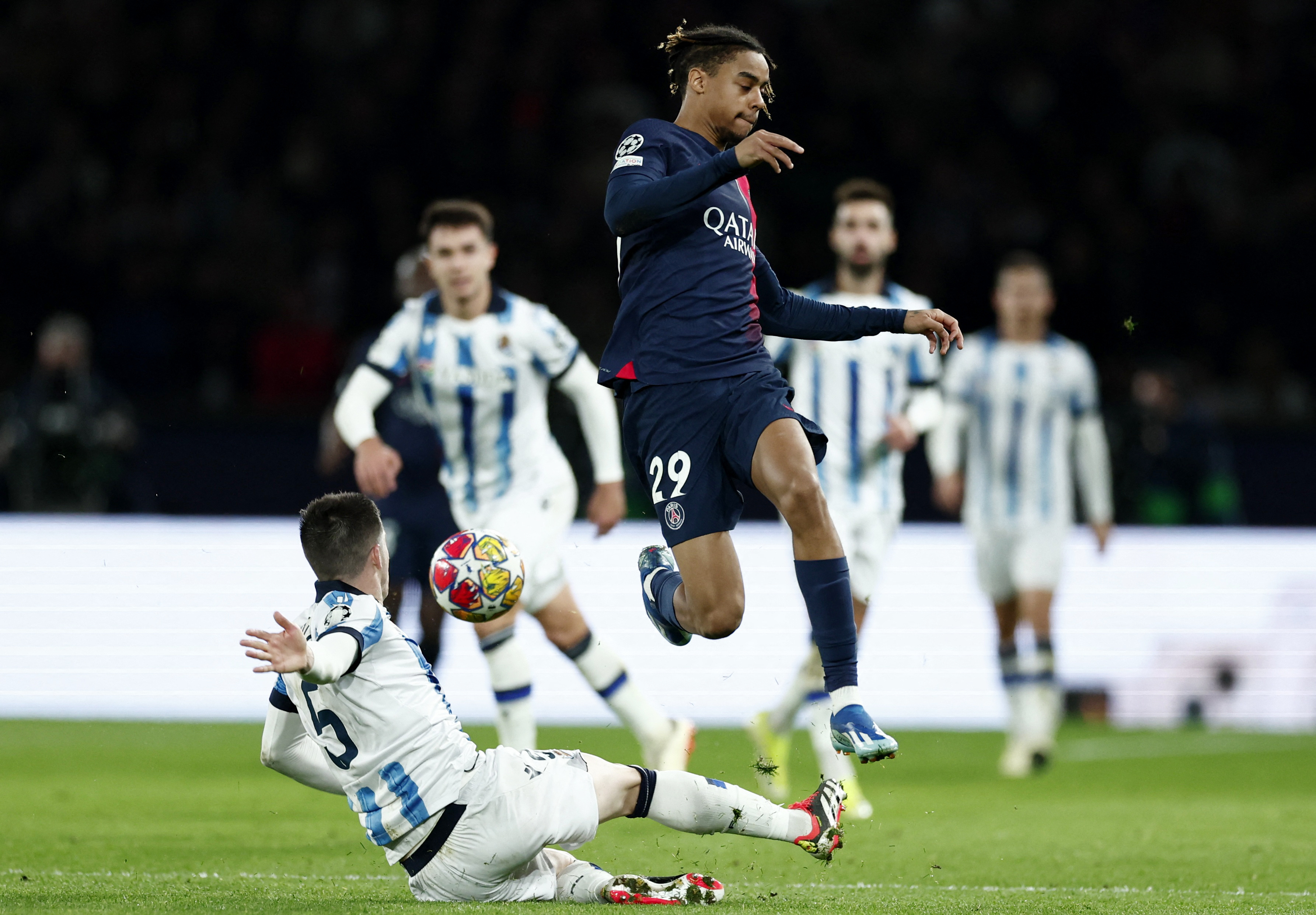 Soccer Football - Champions League - Paris St Germain v Real Sociedad - Parc des Princes, Paris, France - February 14, 2024 Paris St Germain's Bradley Barcola in action with Real Sociedad's Igor Zubeldia REUTERS/Gonzalo Fuentes