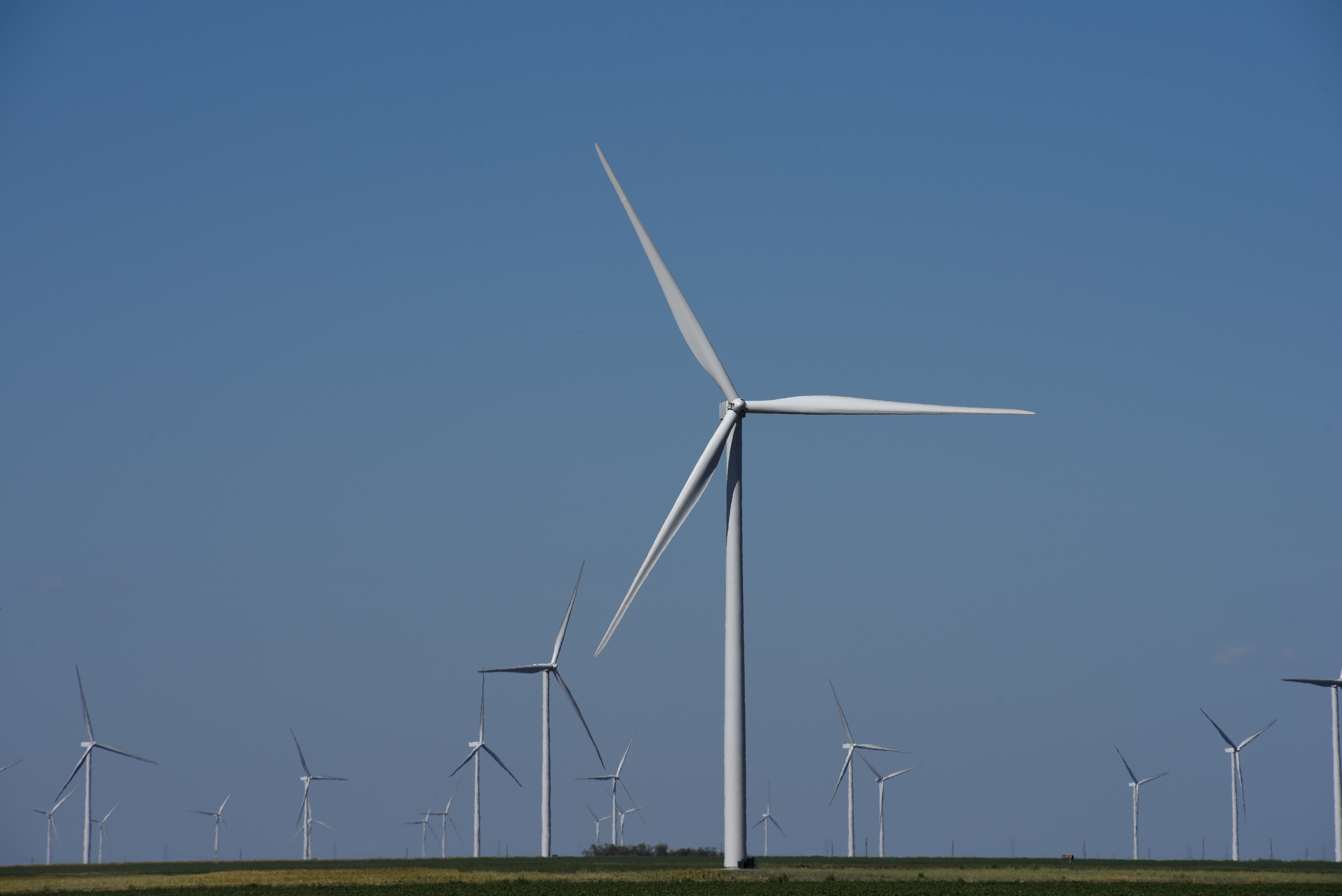 Wind turbines generate power on a farm near Throckmorton