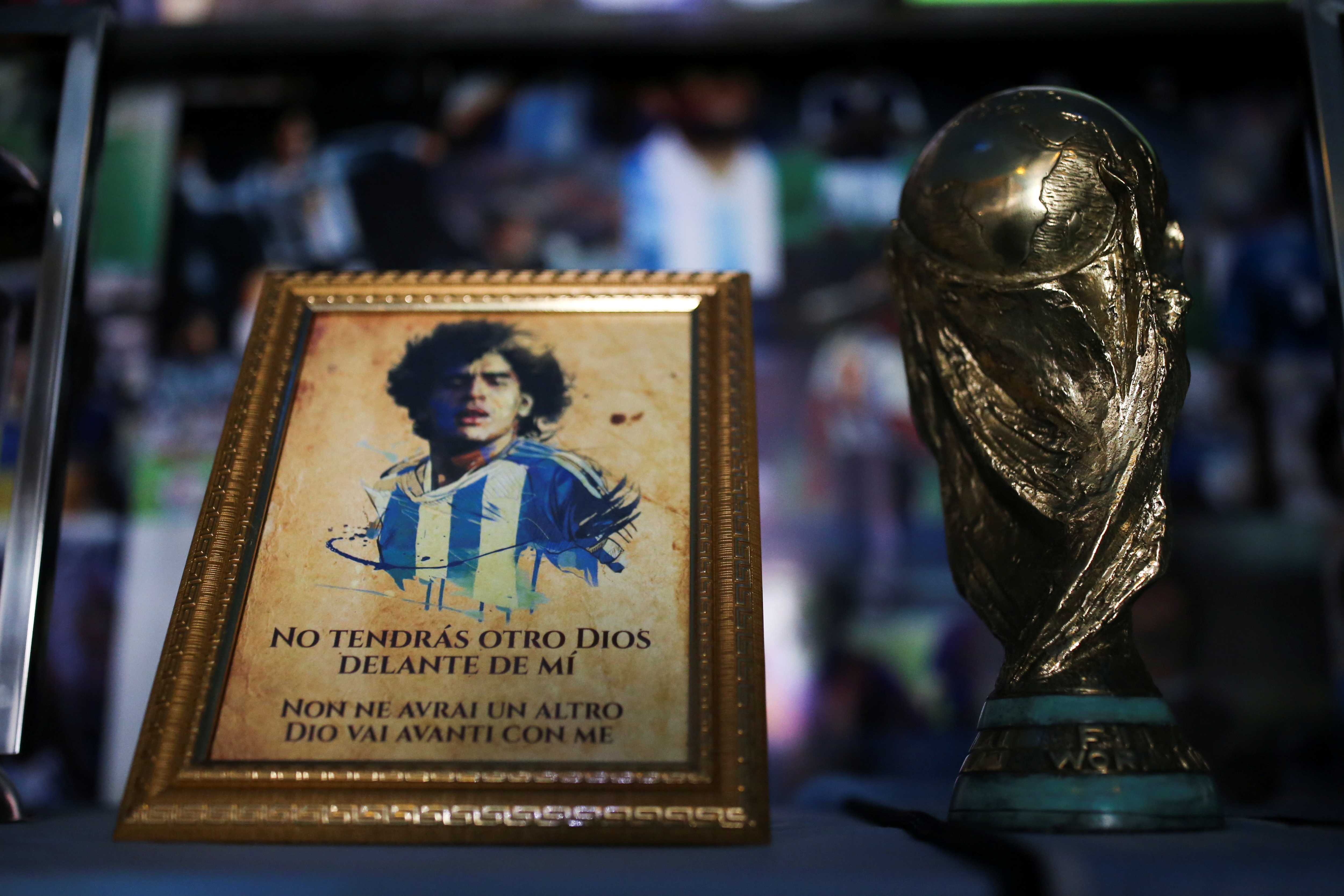 A Maradona's picture and an replica of the World Cup trophy are pictured on an altar at the first Mexico's church in memory of soccer legend Diego Armando Maradona in San Andres Cholula