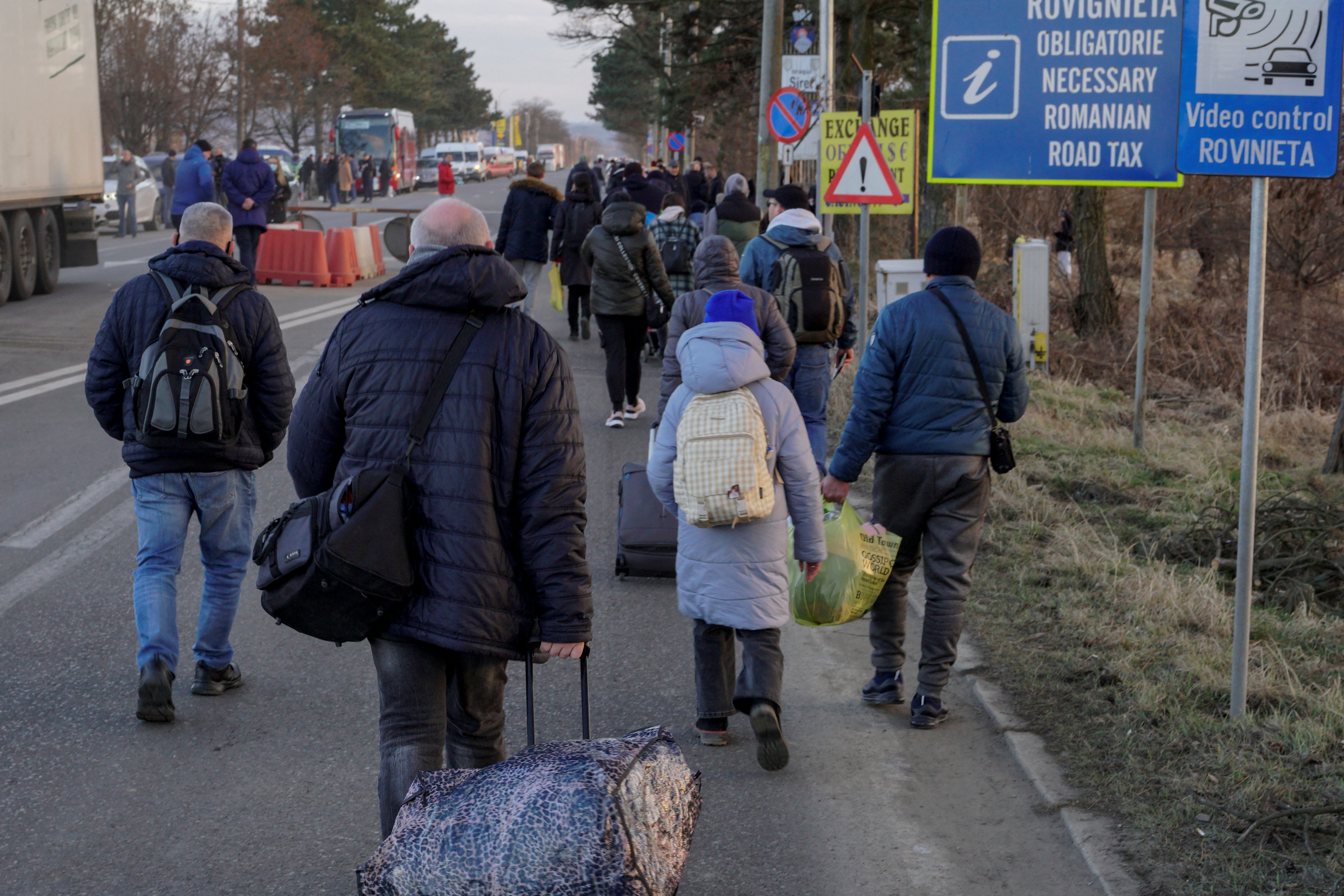 People cross the border from Ukraine into Romania at Siret Customs, in Suceava, Romania, February 24, 2022. Inquam Photos/Casian Mitu via REUTERS 