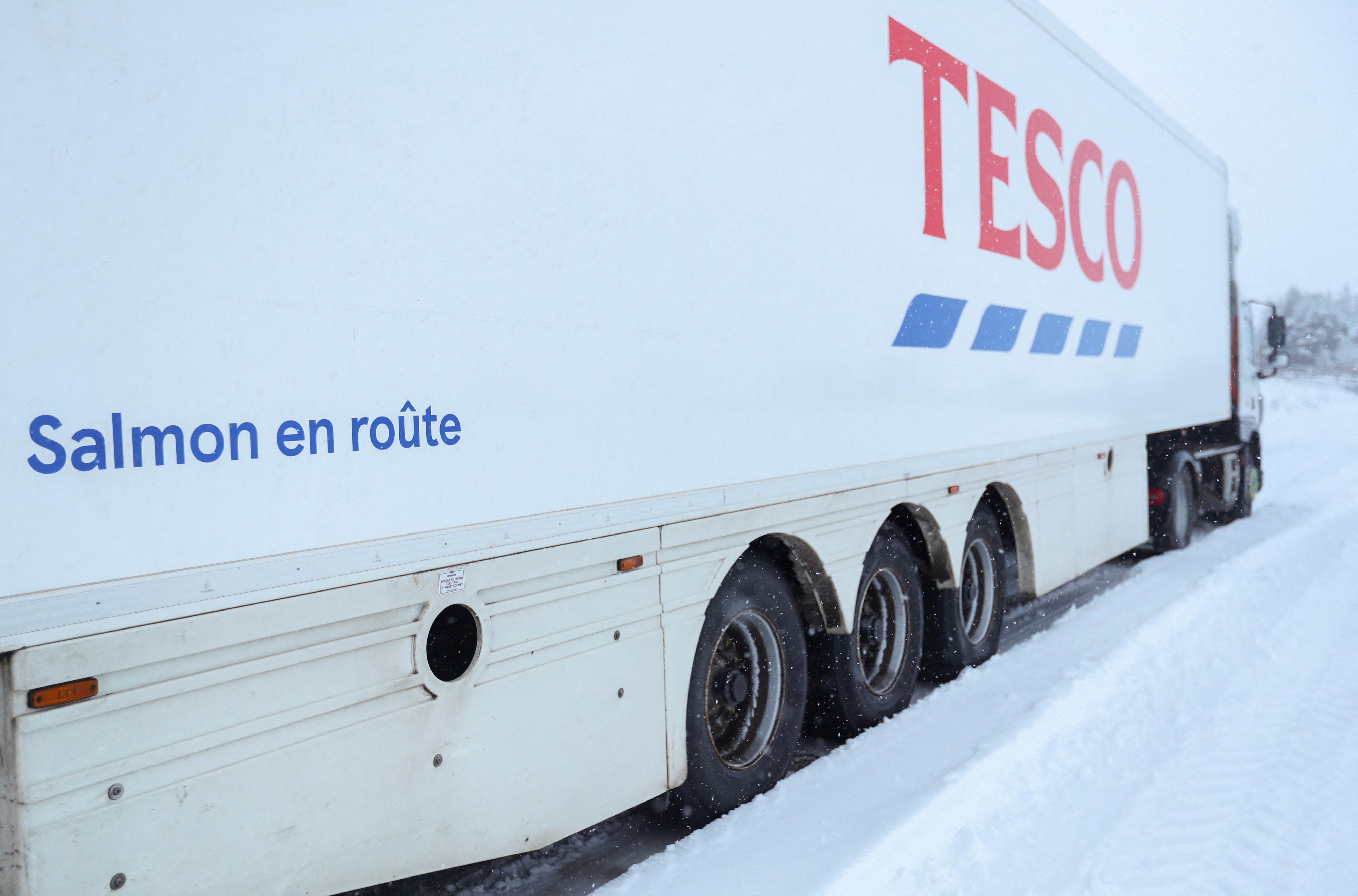 A Tesco lorry is parked in the snow at the Pass of Drumochter