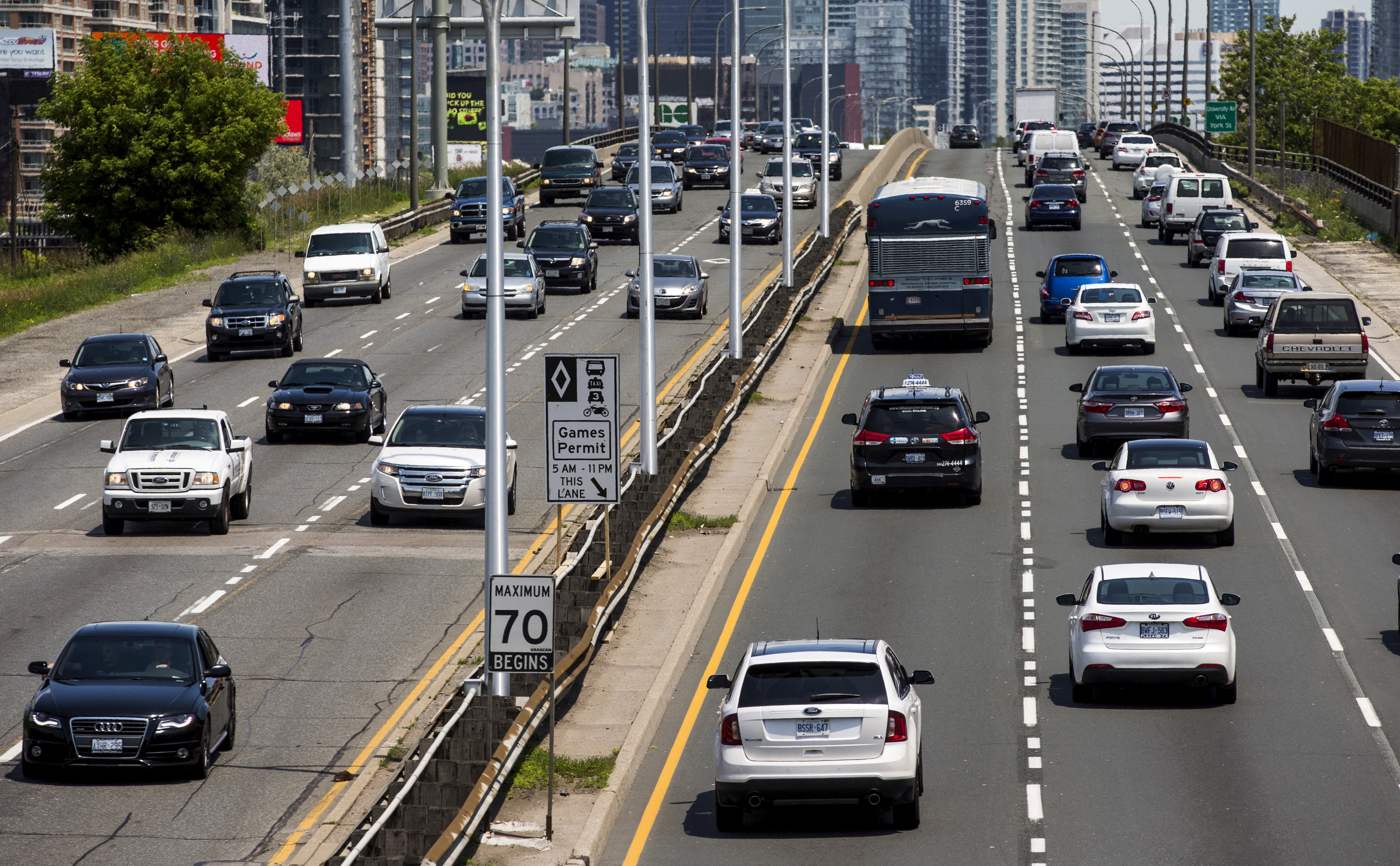 Cars drive on Gardiner Expressway in Toronto