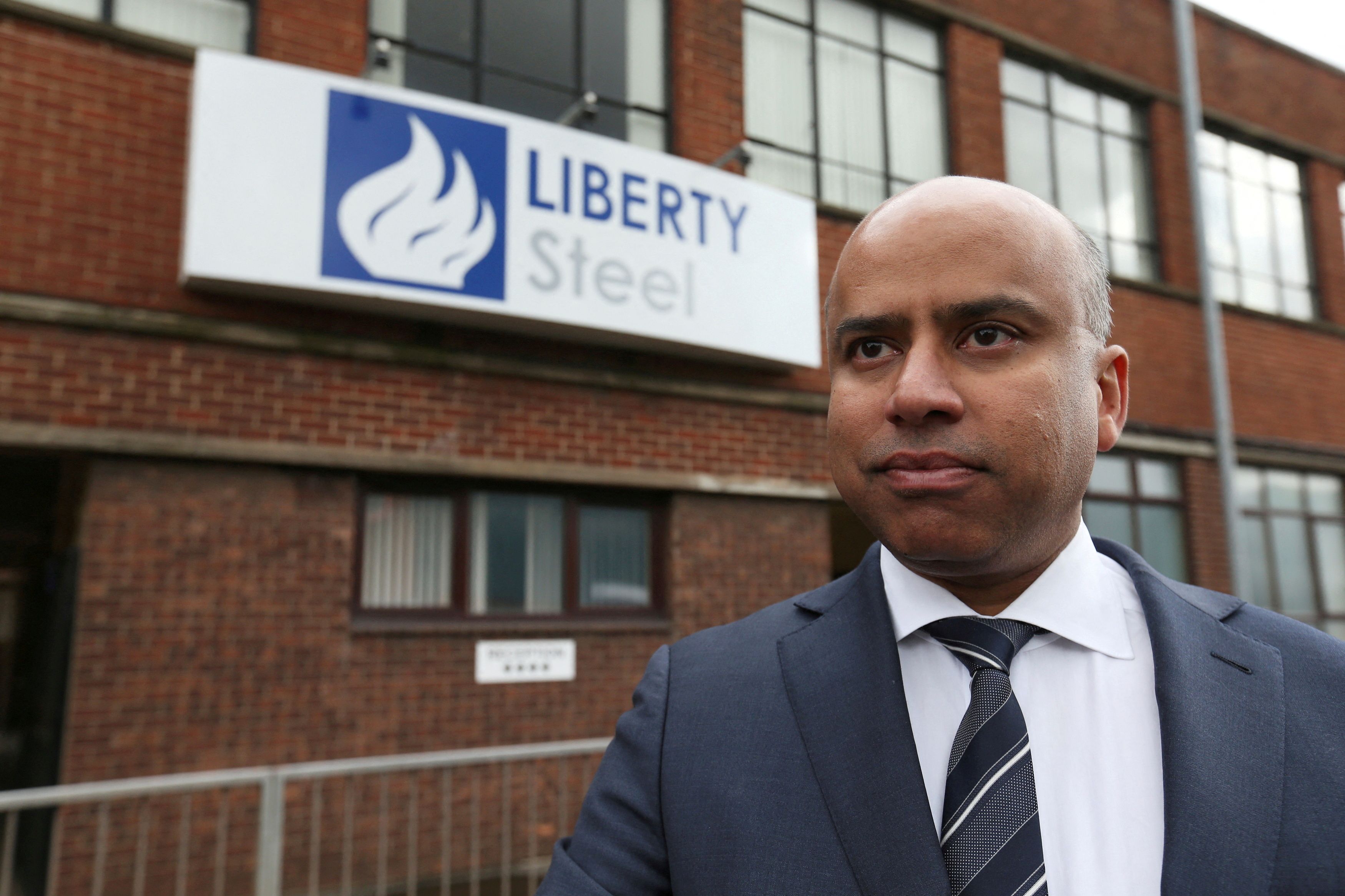 Liberty Steel boss Sanjeev Gupta stands outside steel pressing mill in Dalzell after completing its purchase, Scotland, Britain