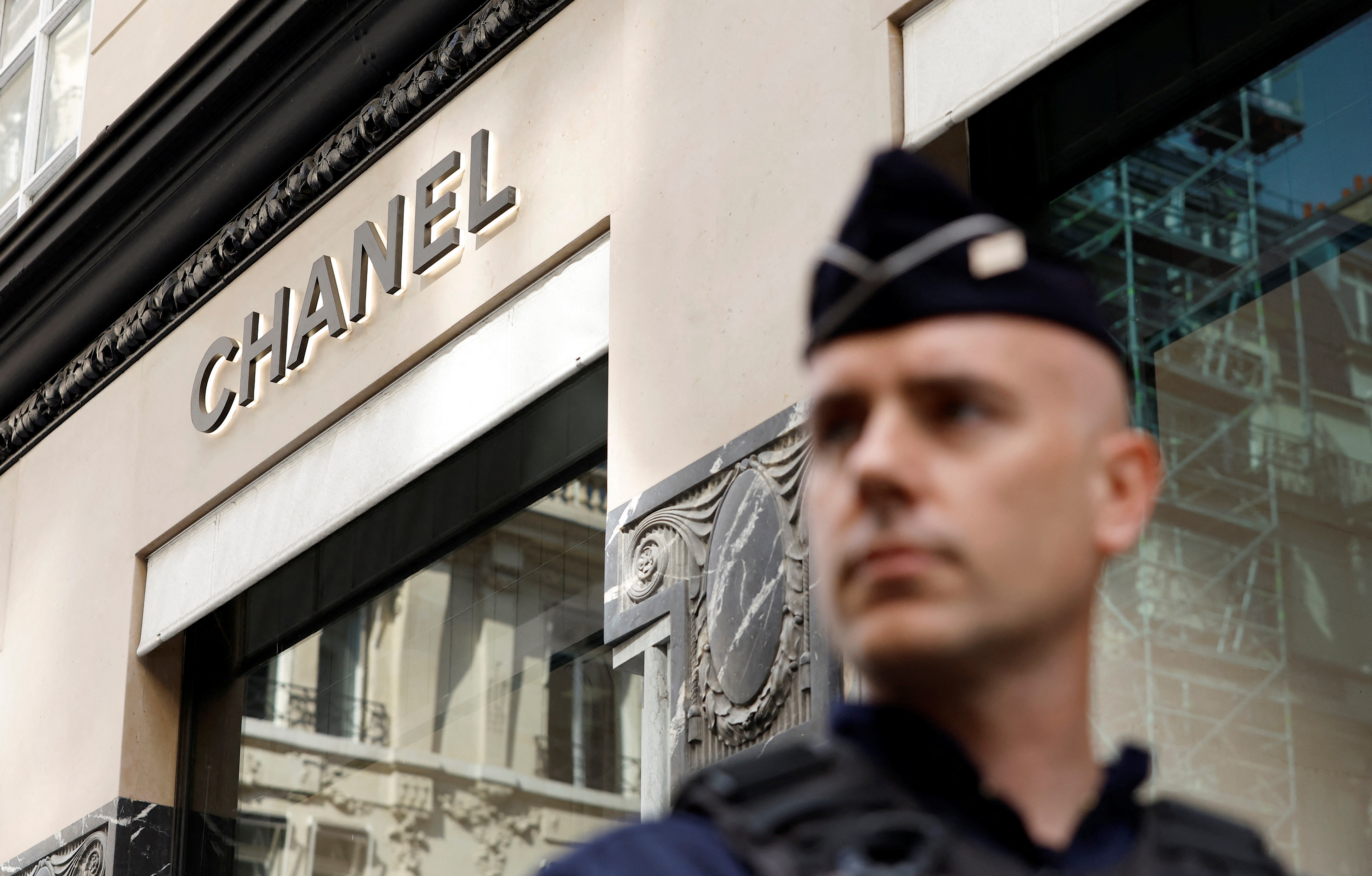 Armed robbers strike Chanel jewellery store in Paris and flee on motorbikes  | Reuters