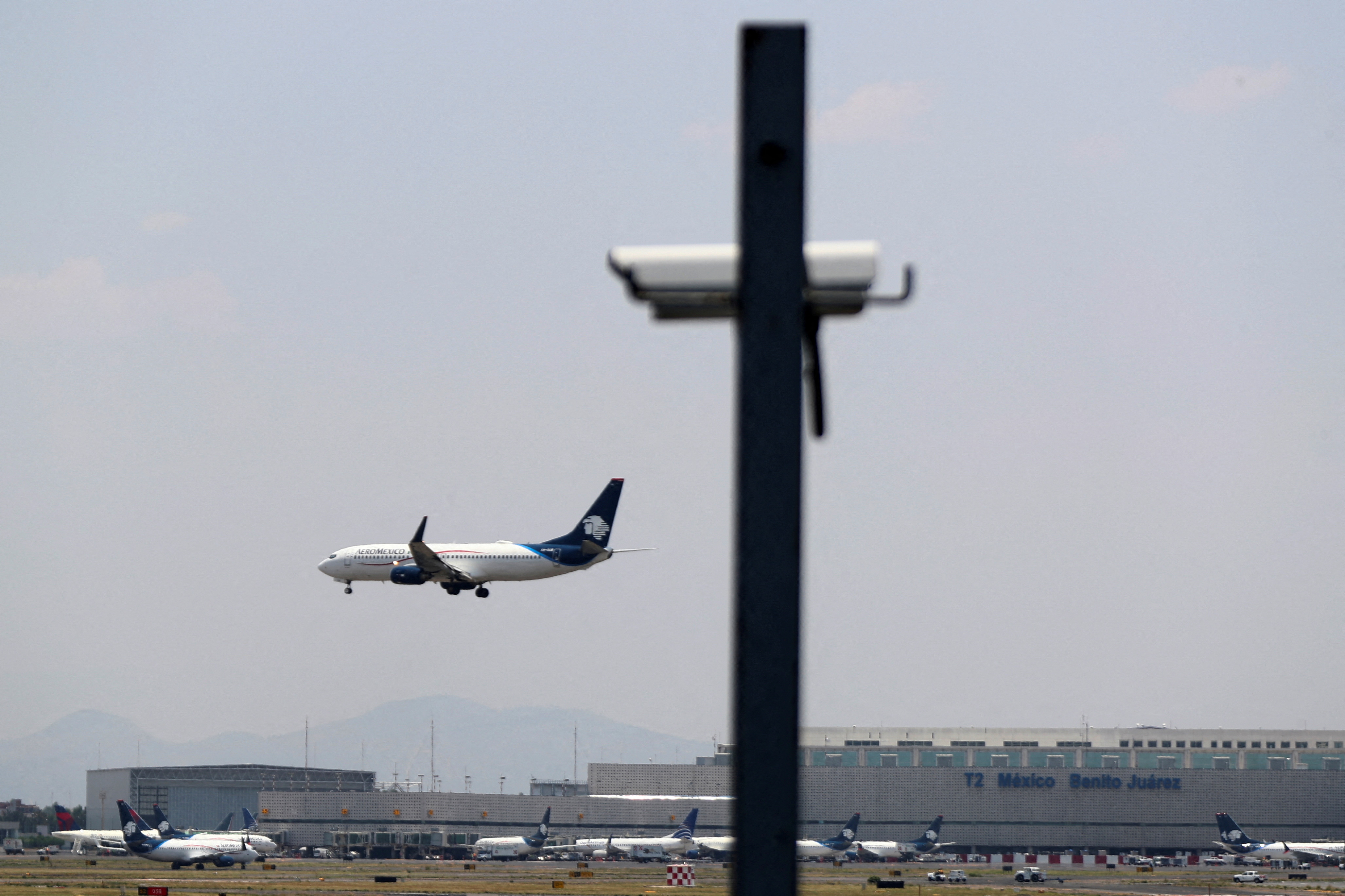 An AeroMexico airplane prepares to land on the airstrip at Benito Juarez international airport in Mexico City