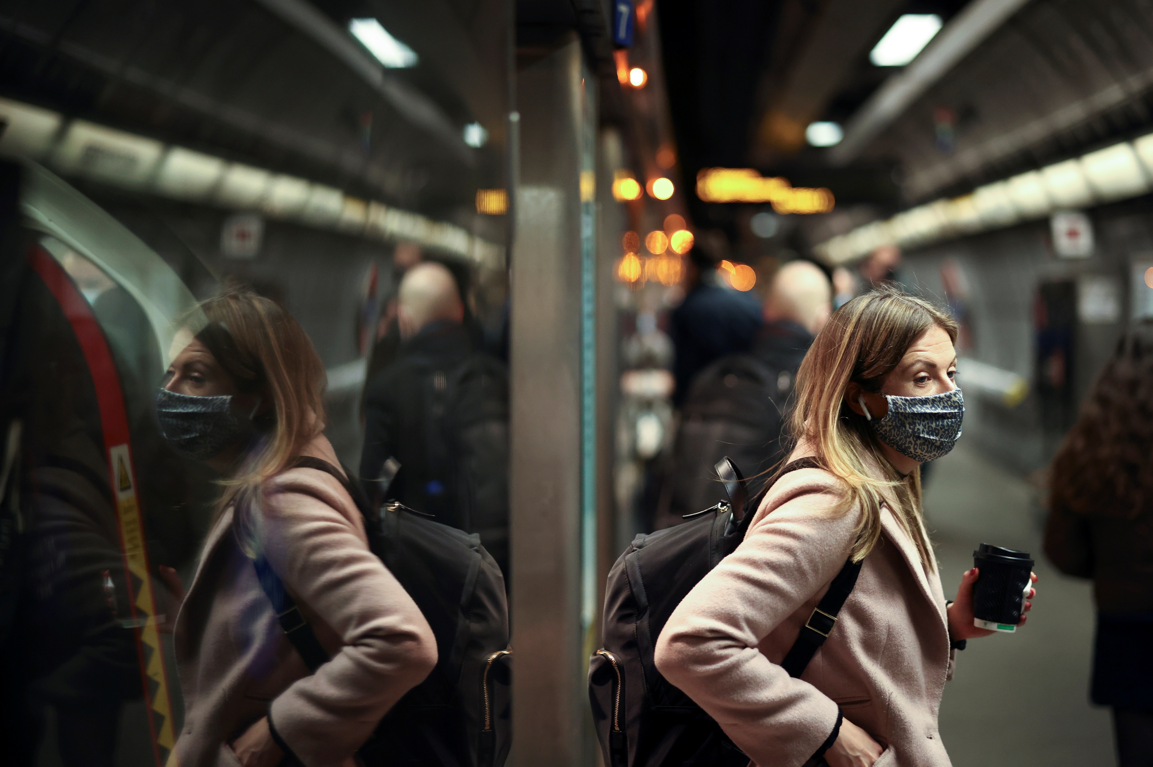A person exits a train at Westminster Underground station during morning rush hour, amid the coronavirus disease (COVID-19) outbreak in London, Britain, December 1, 2021. REUTERS/Henry Nicholls/file photo